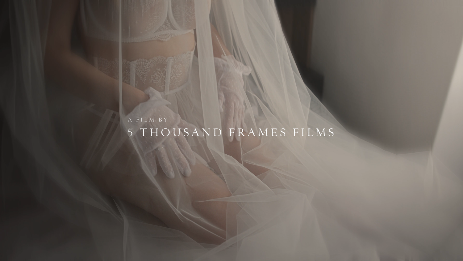 Elegant bridal veil draped softly over a bride, with 5 Thousand Frames Films text overlay in muted tones.