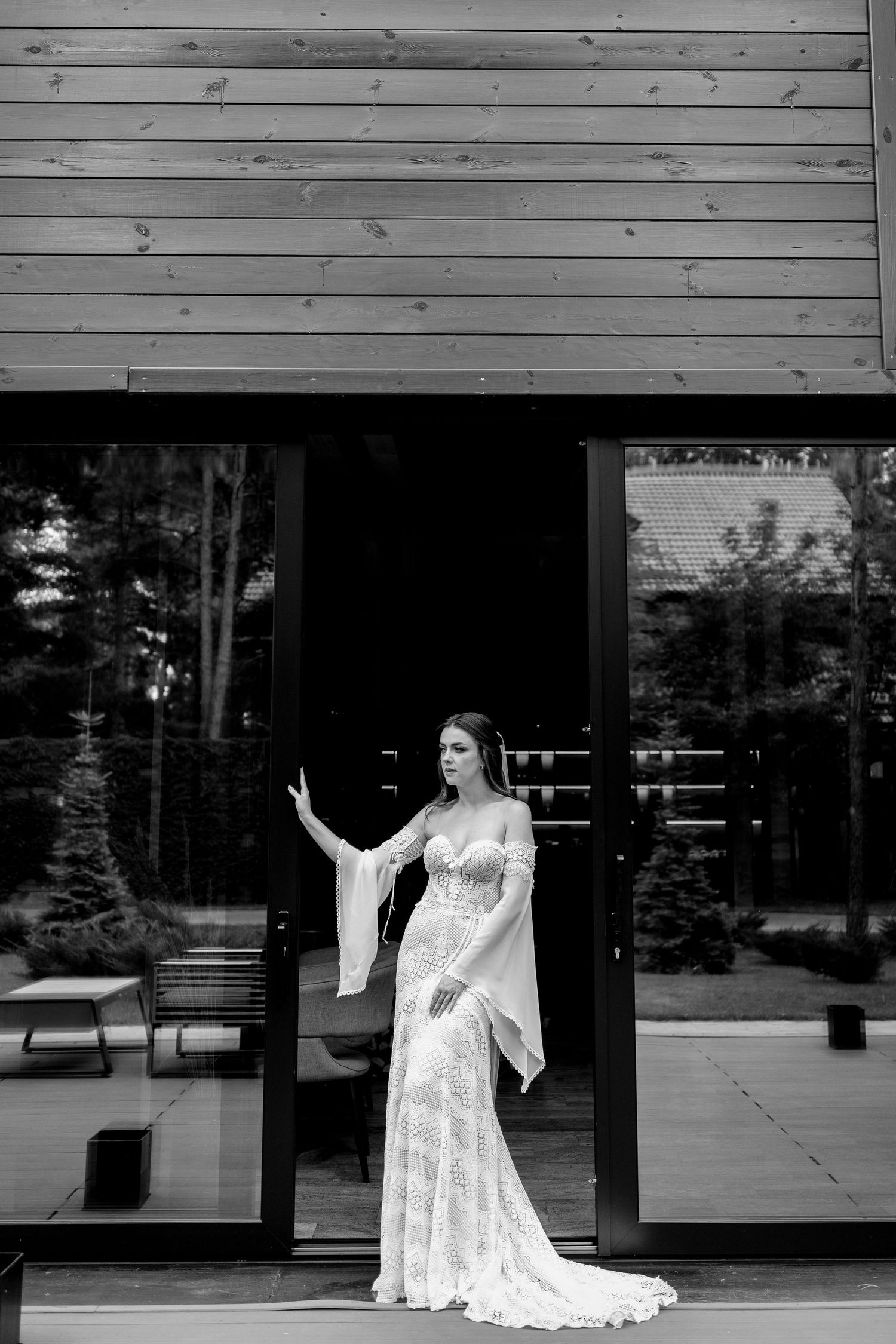 A sequence of artistic bridal portraits showing a woman in a white lace dress posing against a modern building exterior.