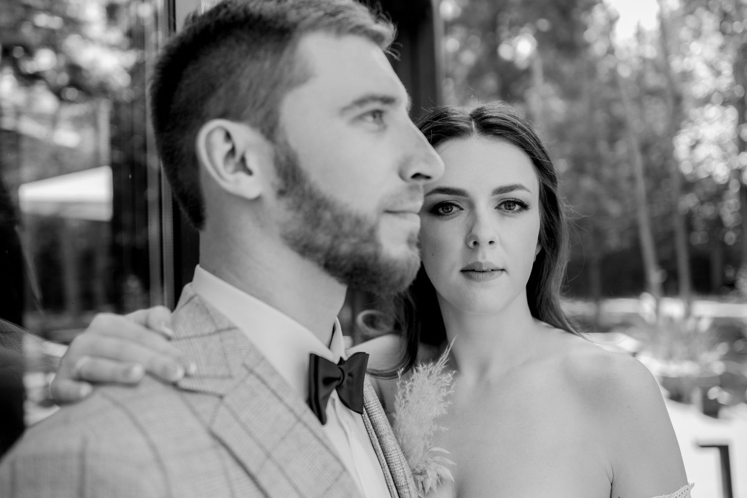 A romantic wedding couple shares intimate moments in a series of close-up shots.