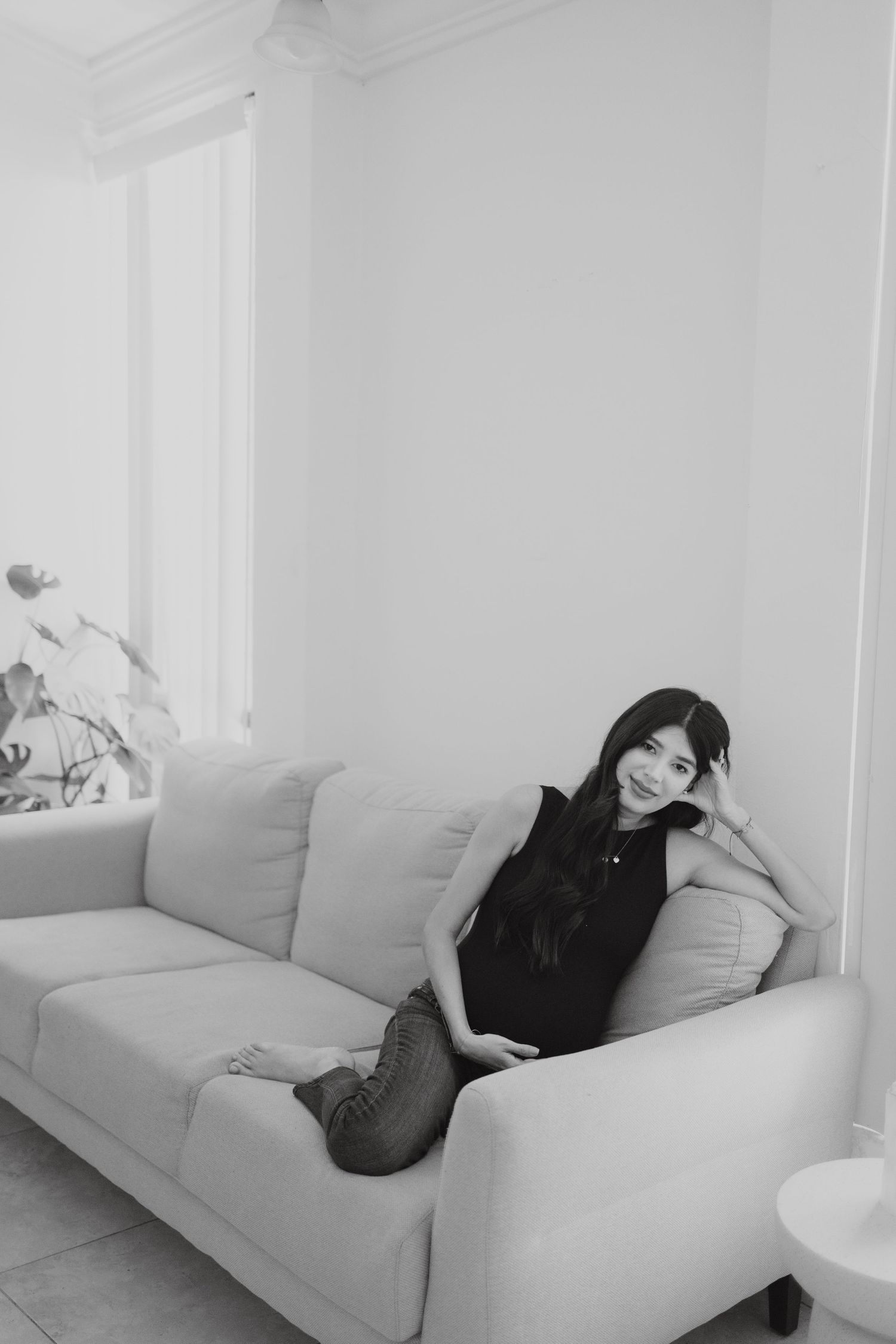 Minimalist interior photo series showing a light gray couch against white walls.