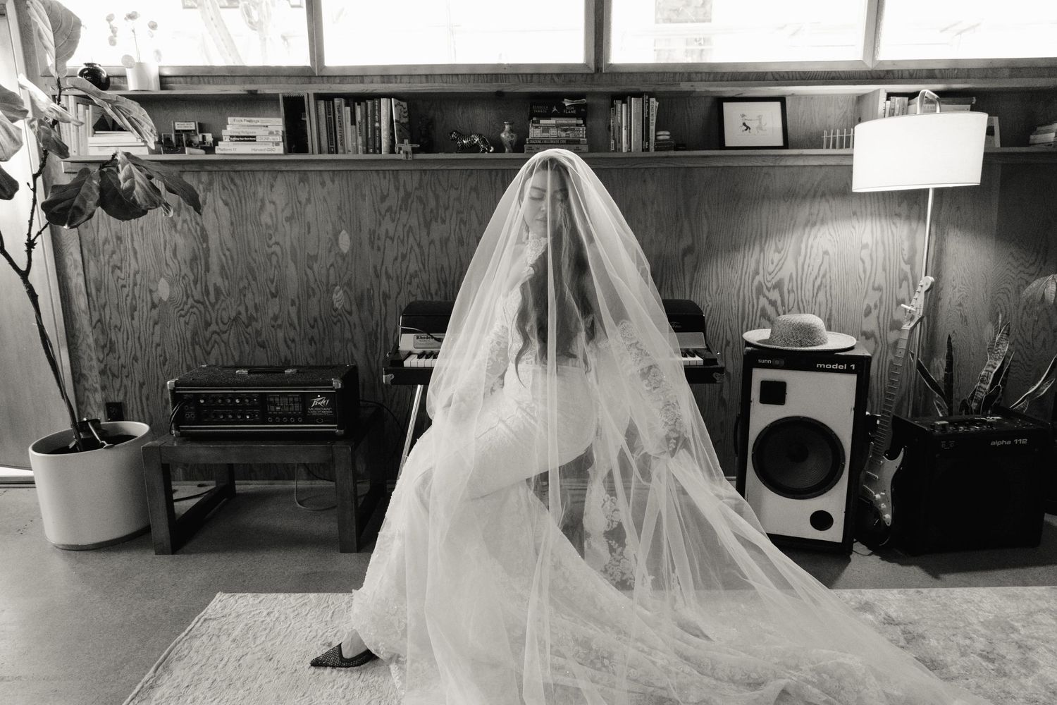A bride in a white wedding gown and veil walks through a hallway in a collage of similar wedding preparation scenes.