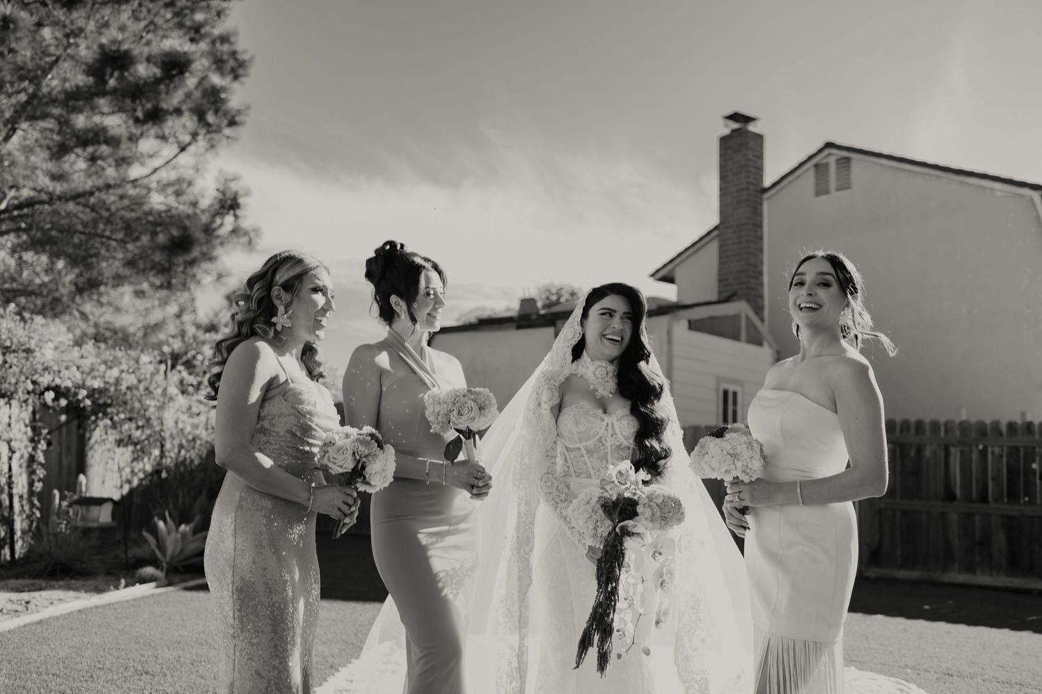 A series of black and white wedding photos showing joyful moments between couples and guests during an outdoor celebration.