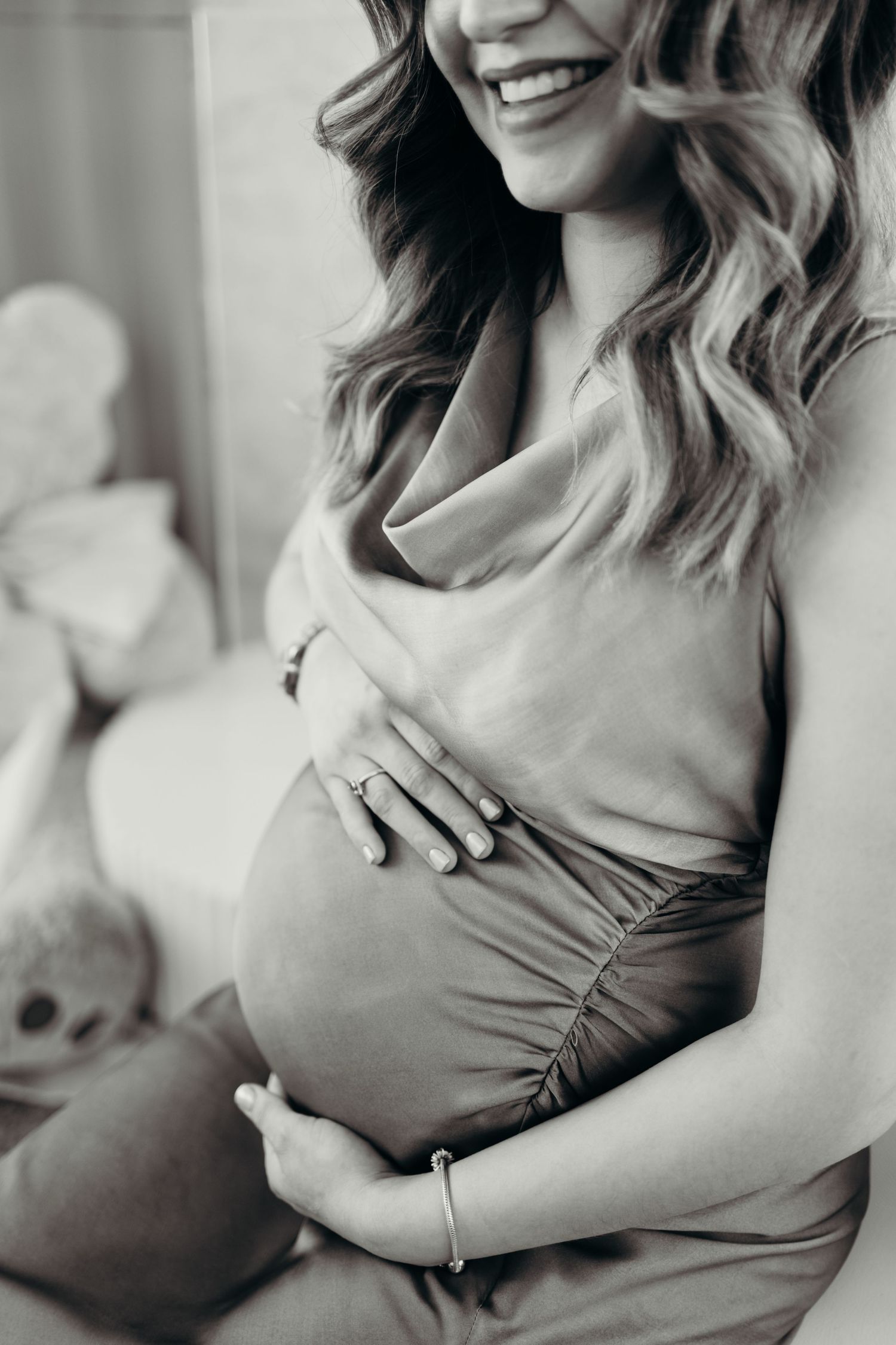 Black and white portrait series showing tender moments during pregnancy.