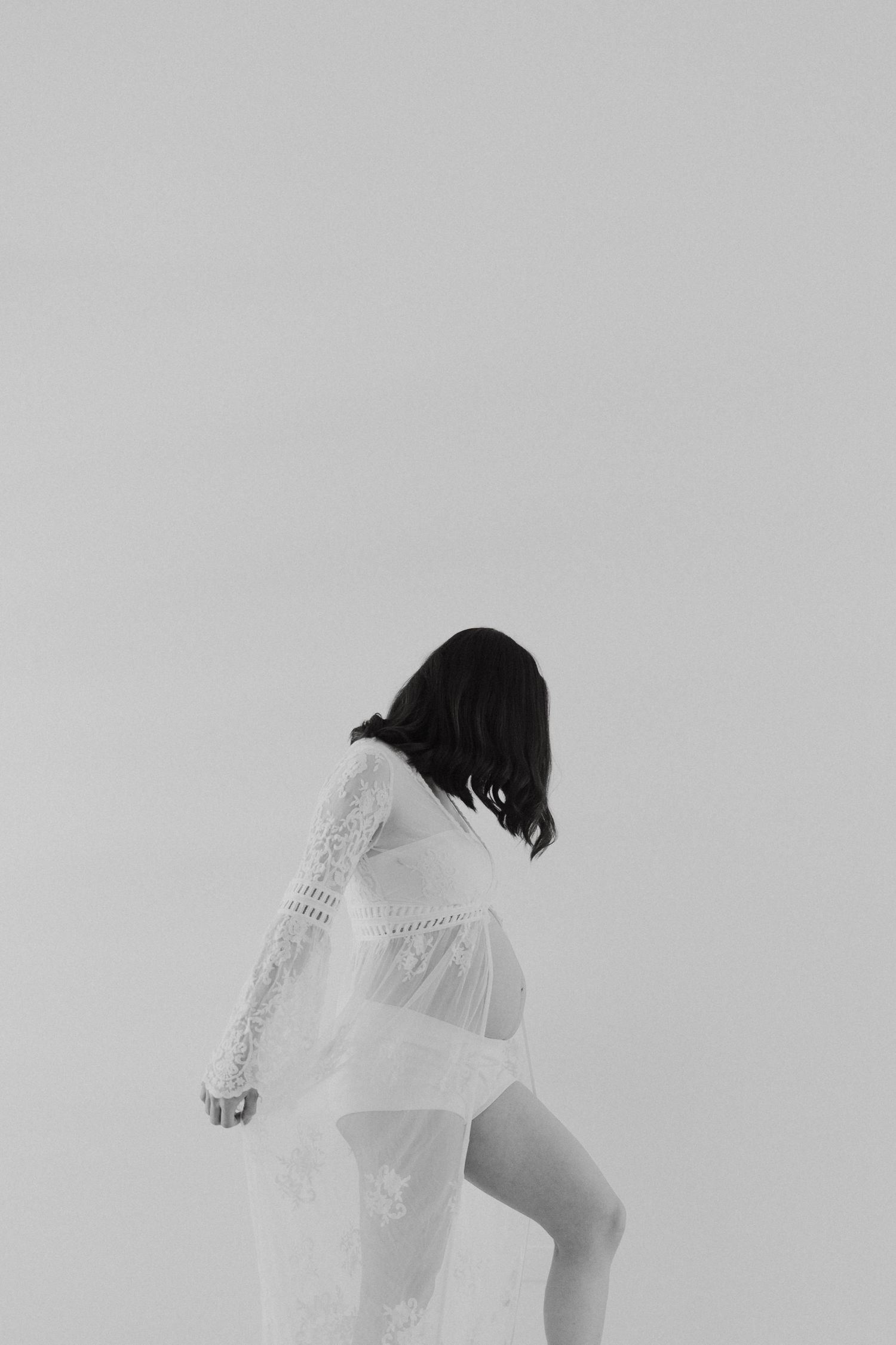 Ethereal black and white photos showing flowing white lace fabric movement.