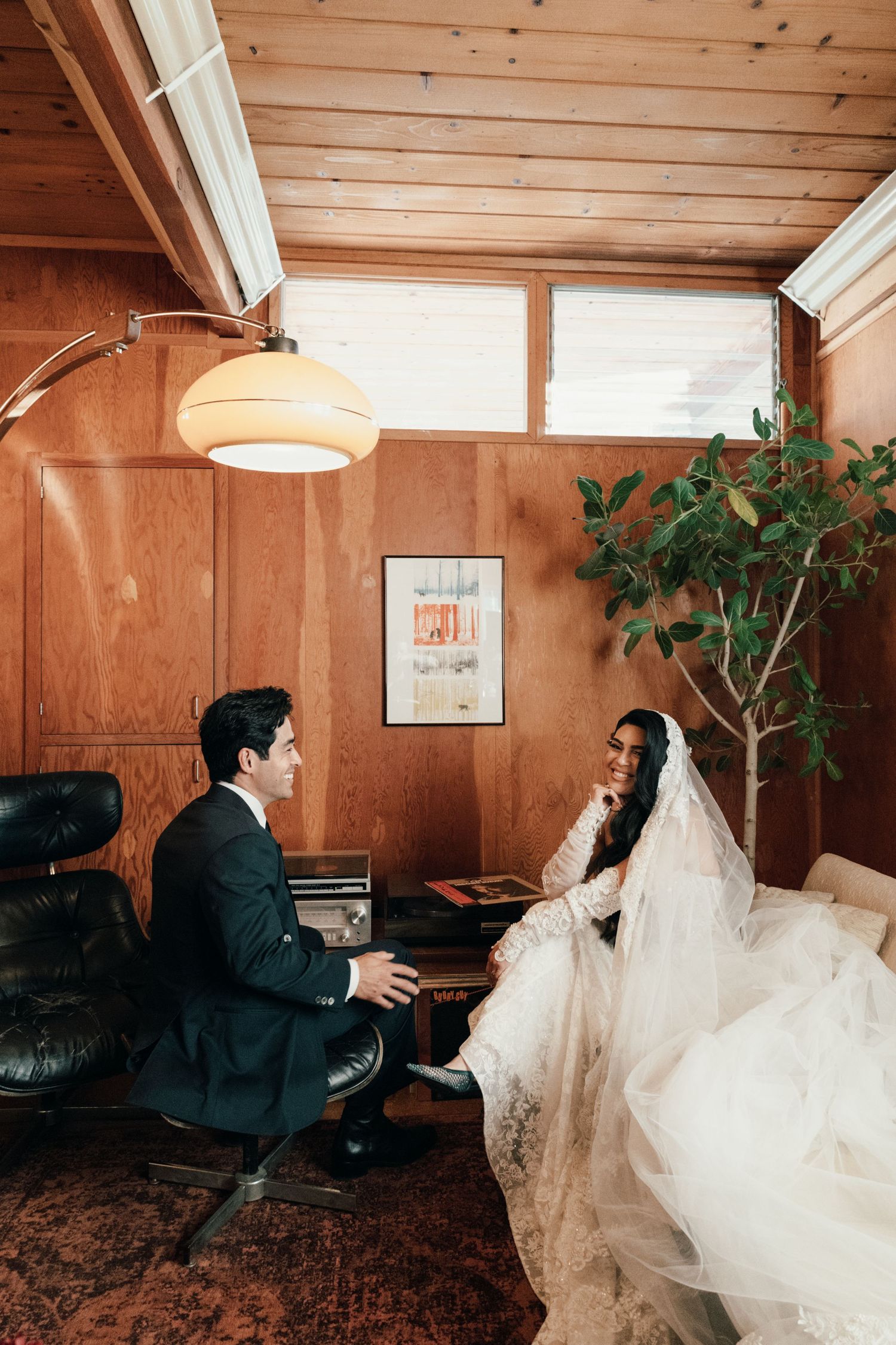 A sequence of romantic wedding photos showing a couple in a wood-paneled room with flowing white dress movement.