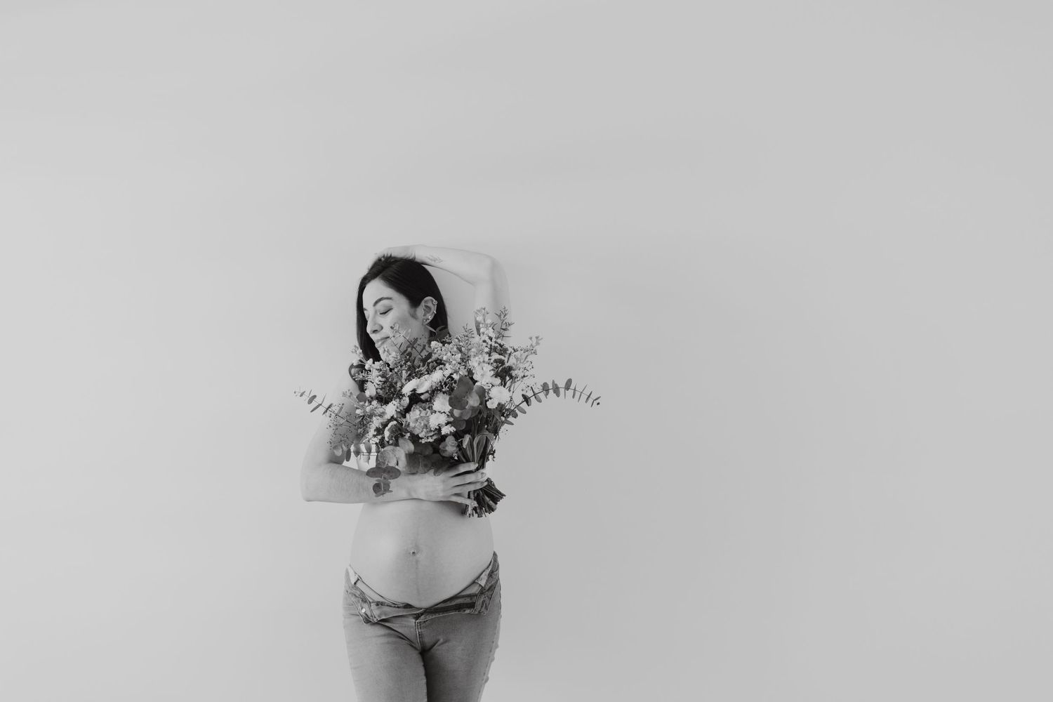 Artistic black and white series with delicate floral elements and soft lighting.