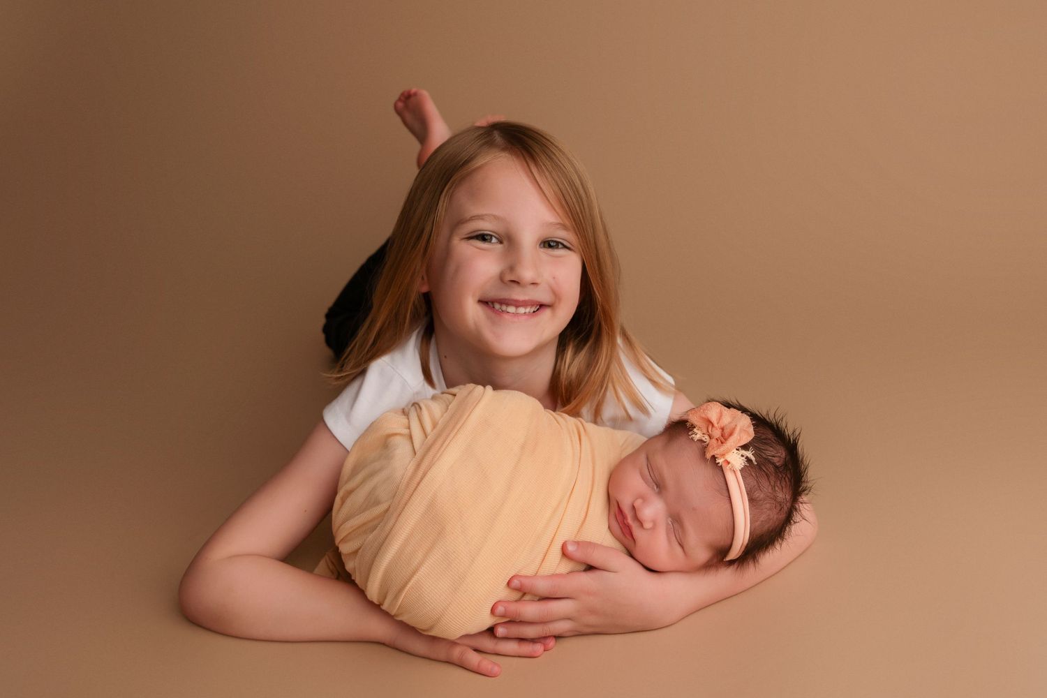 Natural lifestyle portraits capturing genuine smiles and connections in a studio setting.
