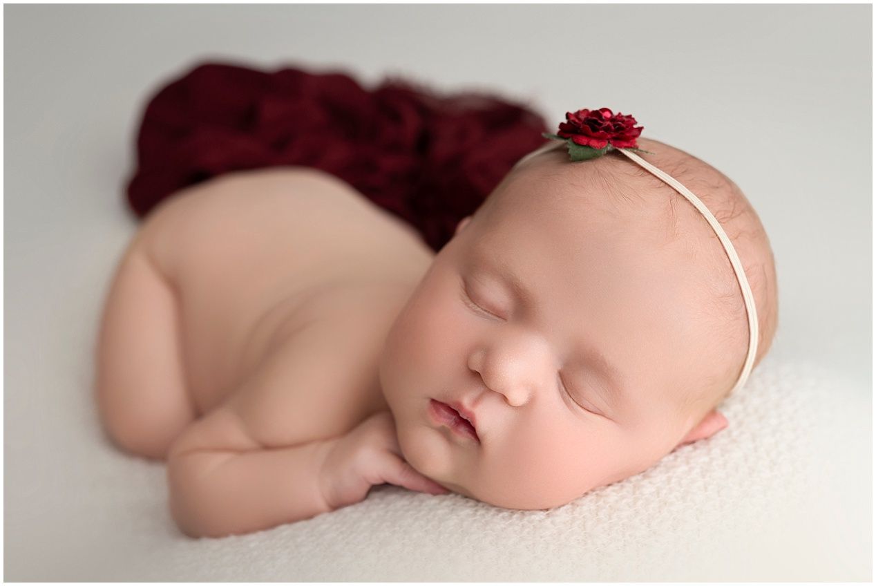 A series of artistic newborn baby photographs showing peaceful sleeping poses with soft lighting and neutral backgrounds.