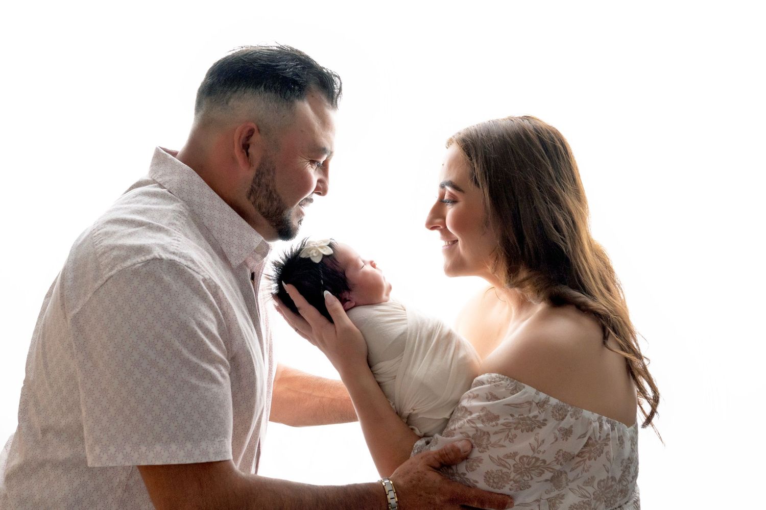 A romantic black and white photo series showing tender moments between a couple during their wedding day.