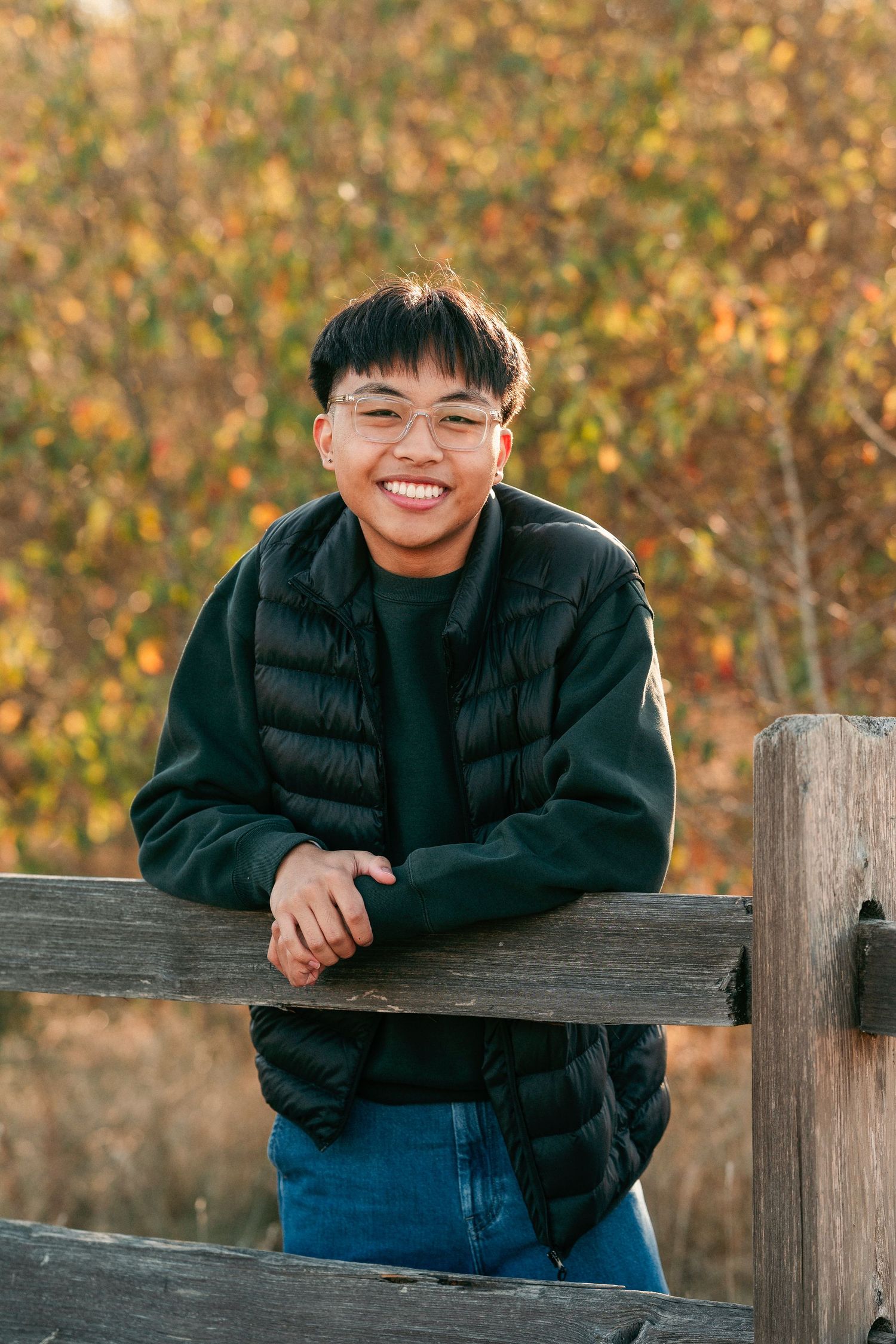 A series of casual outdoor portrait photos taken against an autumn background with wooden fence posts.