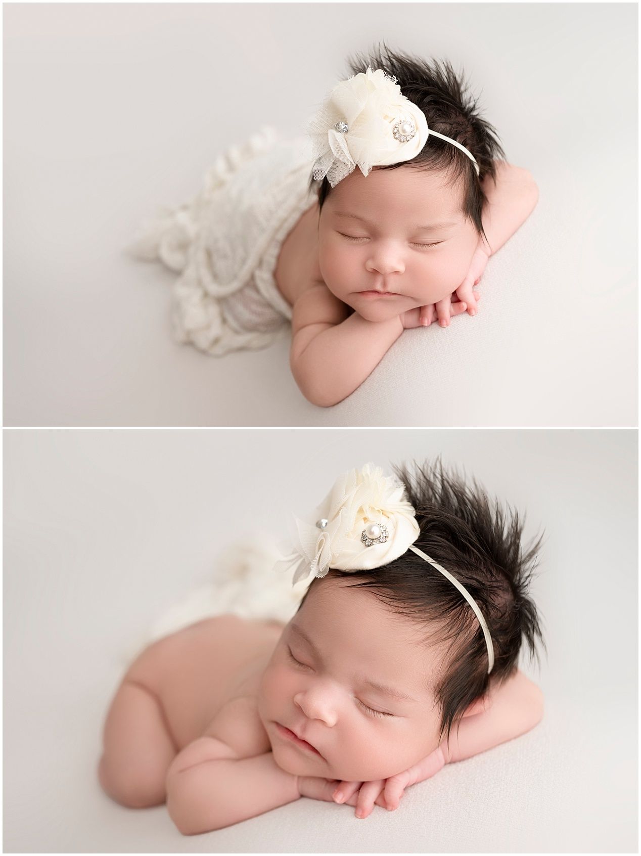 A sleeping newborn baby wearing a delicate white flower headband rests peacefully on soft white fabric.
