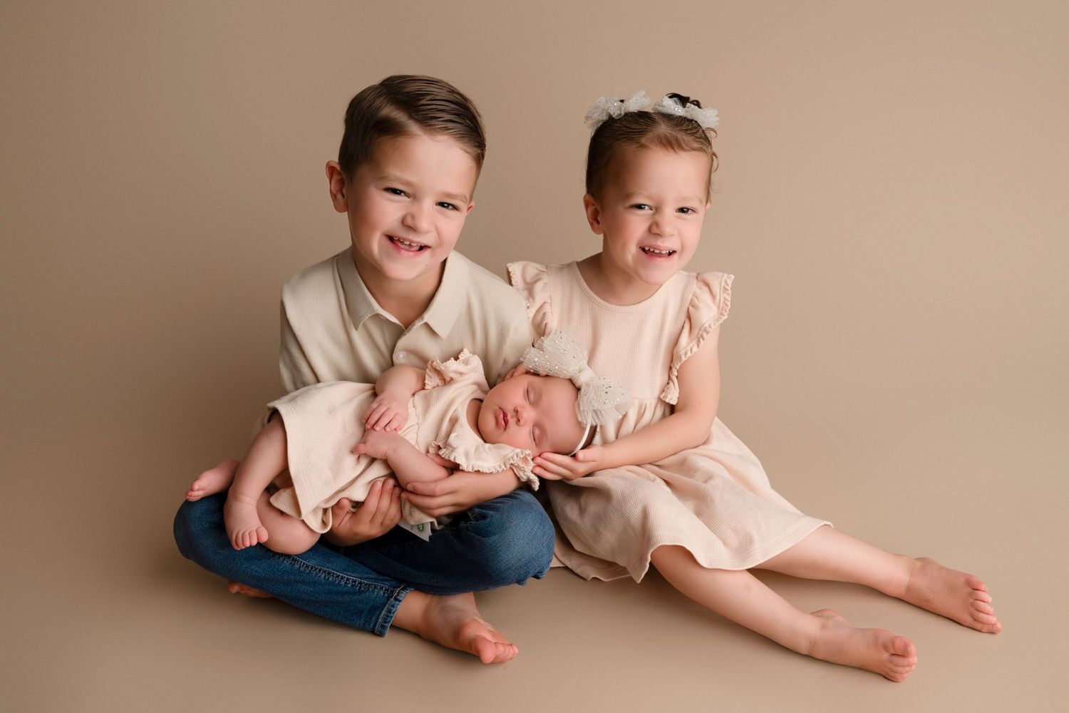 A series of candid sibling photos showing children playing and laughing together on a beige background.