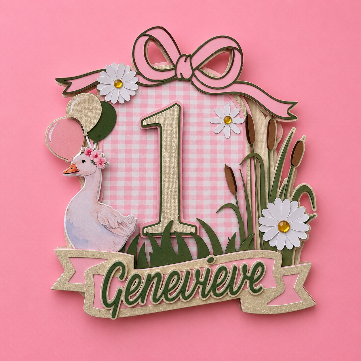 Pink gingham first birthday cake topper with number 1, duck, daisies, balloons, and name Genevieve on banner.