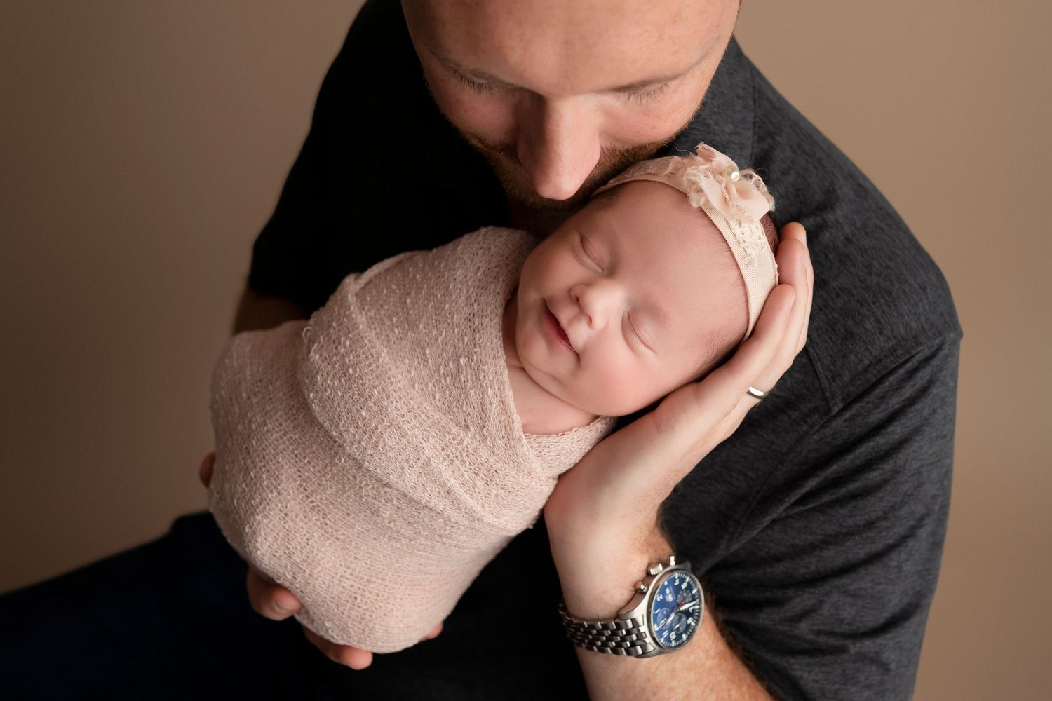 A series of intimate black and white portraits showing tender moments between two people in soft lighting.