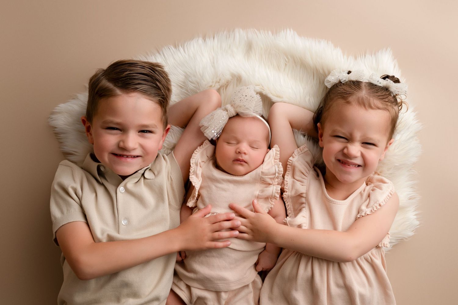 A series of connected photos showing siblings with a newborn baby in soft, neutral tones.