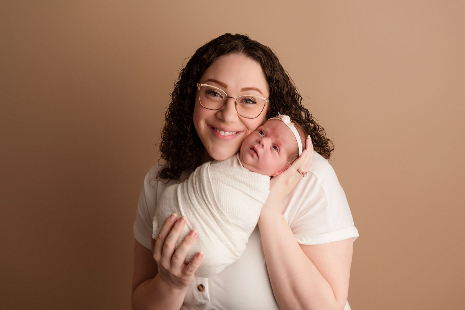 A series of candid lifestyle portraits showing joyful expressions and warm embraces against a neutral background.