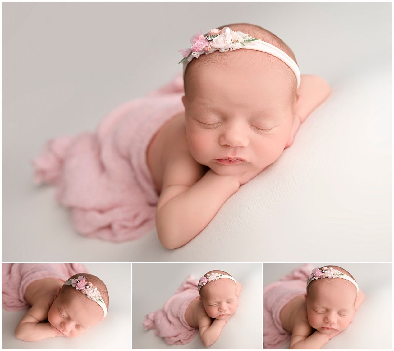 Sleeping newborn baby wearing pink floral headband posed on soft pink blanket in professional studio setting.