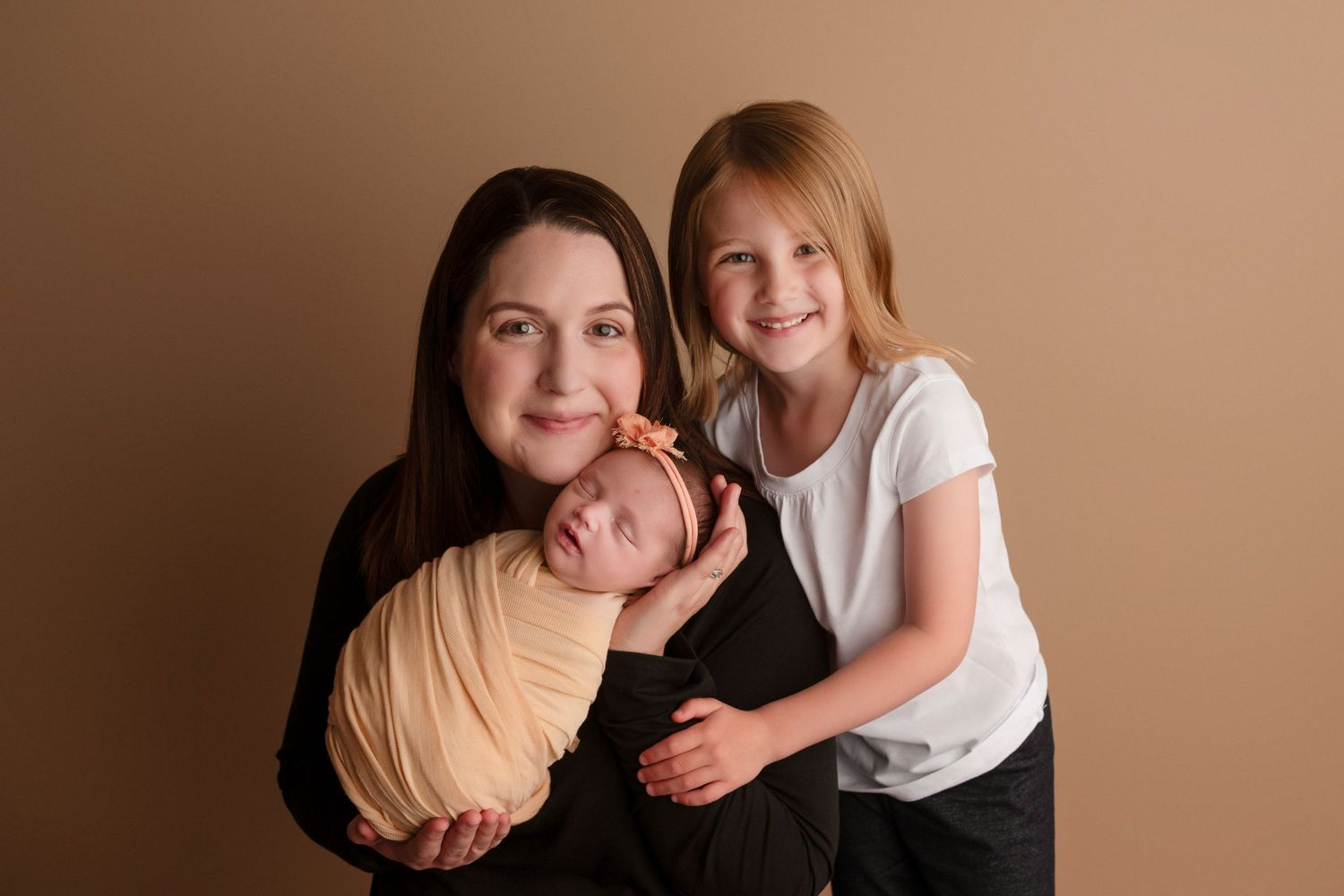 A heartwarming photo series showing tender moments between family members against a warm brown backdrop.
