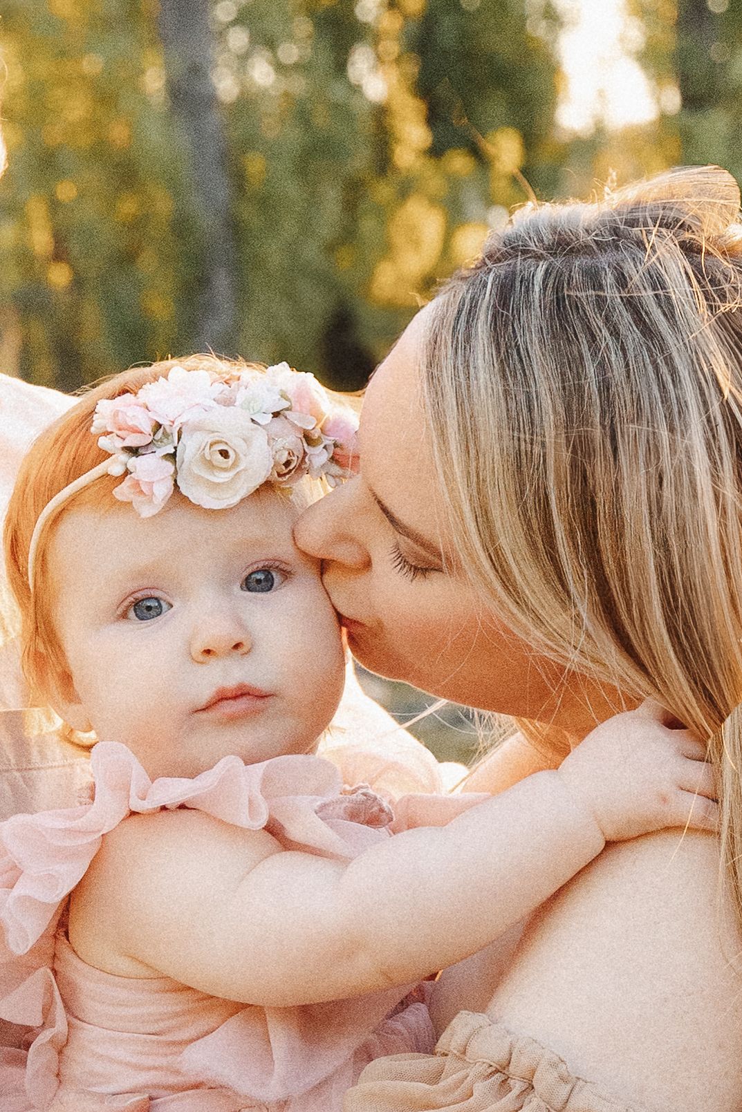 Mother kissing baby in sunset family photography Canberra