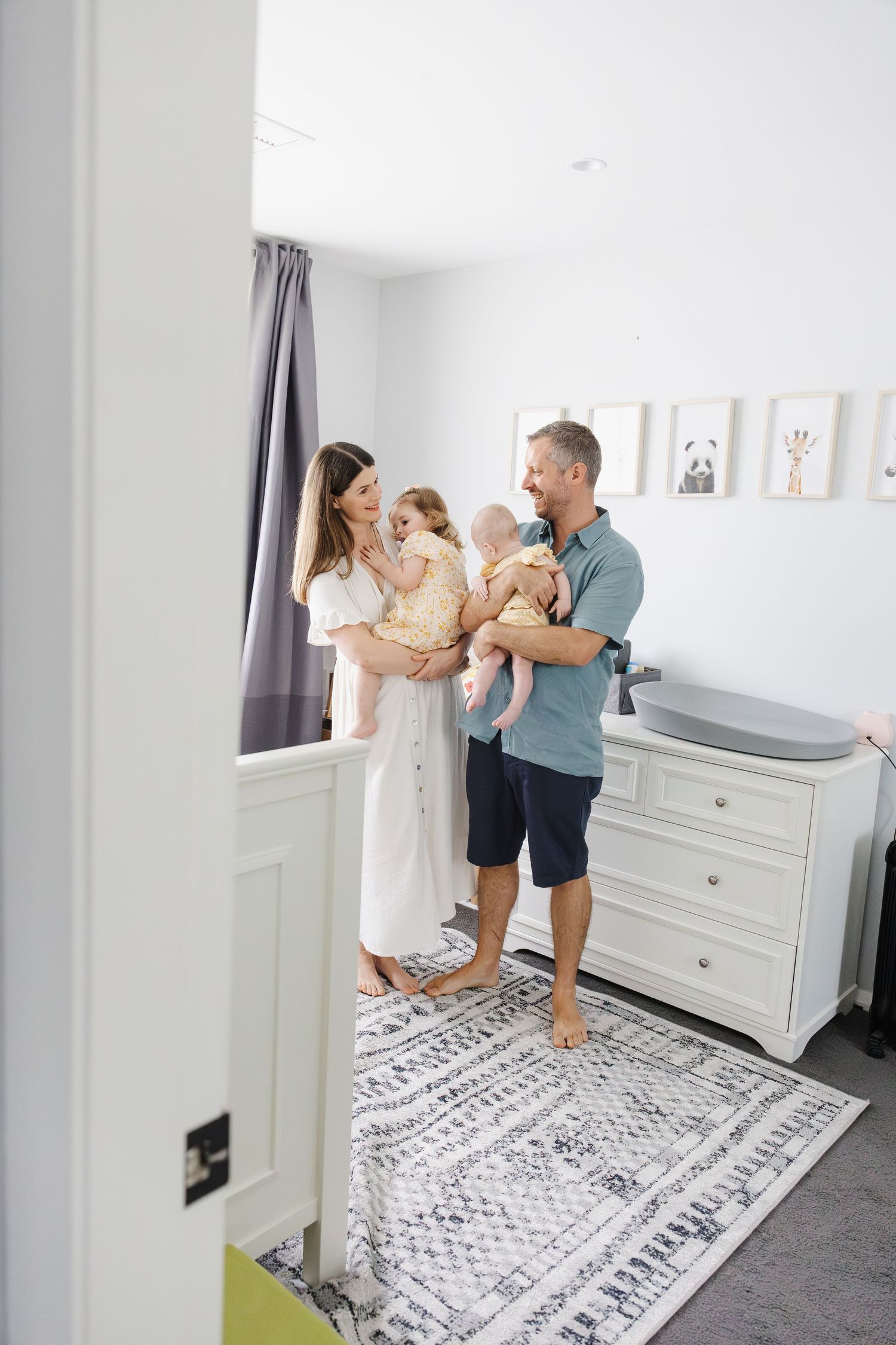 Family hangs out in nursery with kids in their Canberra home