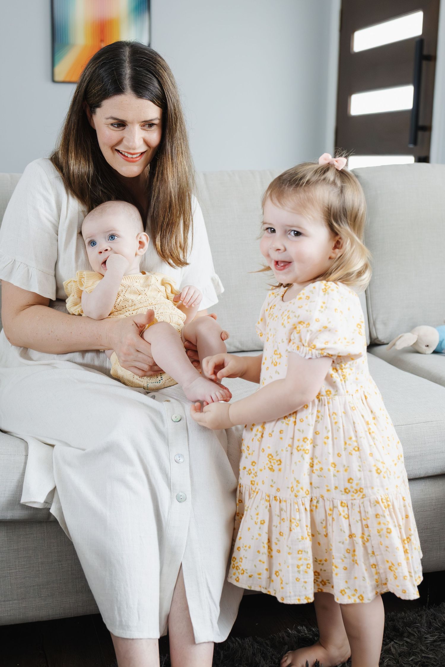 Canberra mum cuddles her two daughters during Canberra family photoshoot