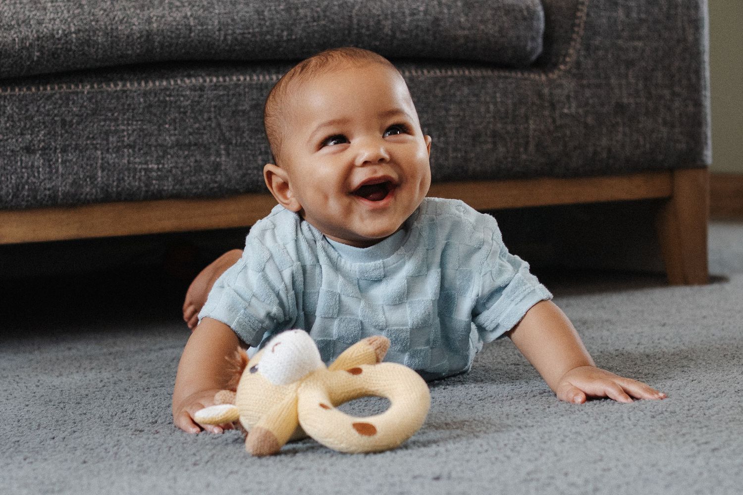 Laughing 6 month old baby captured by Canberra family photographer