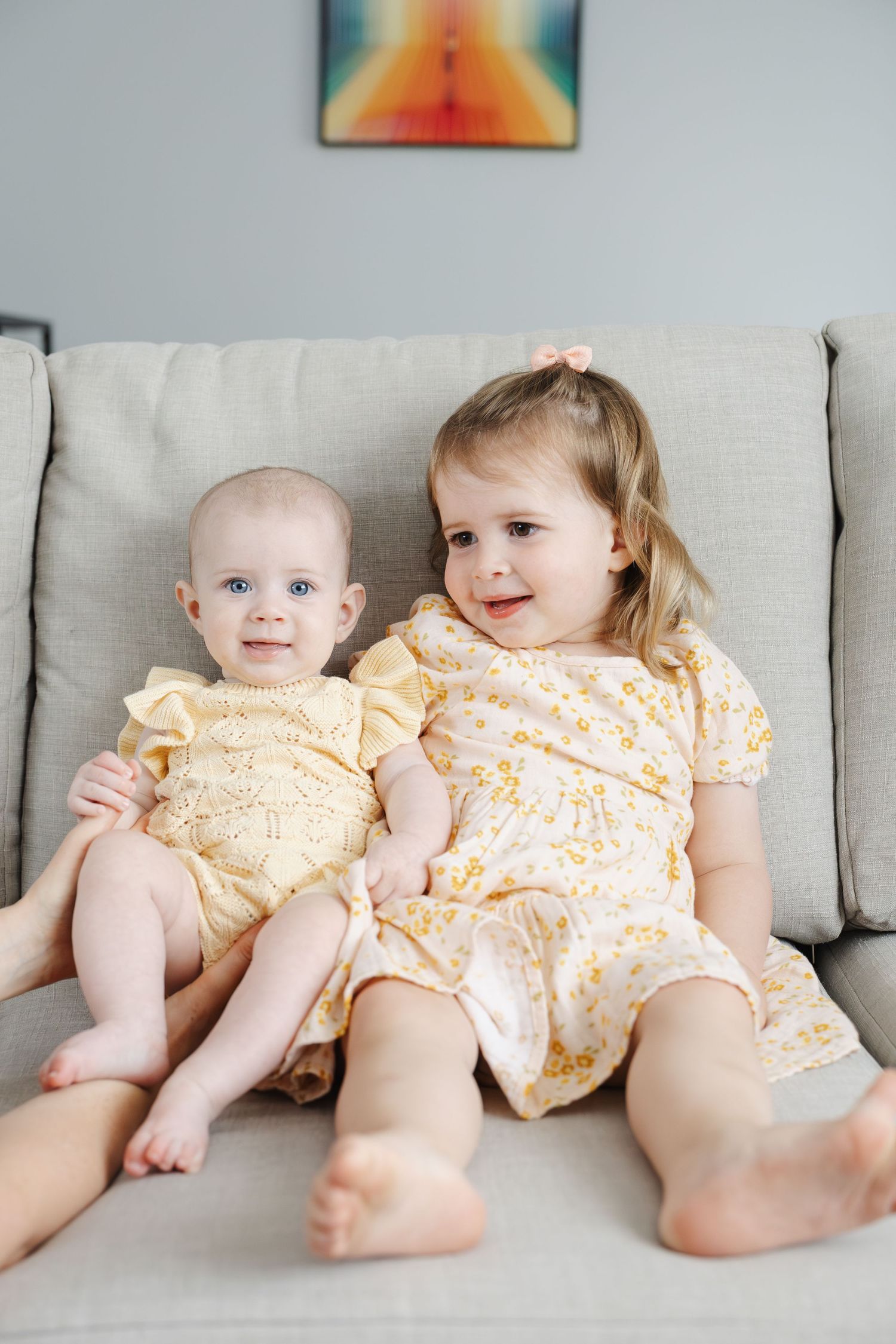 Two sisters in matching yellow outfits during Canberra family photoshoot