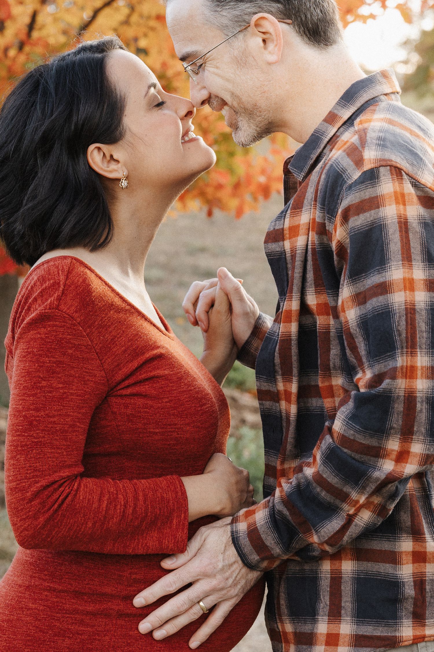Loving couple in Canberra autumn pregnancy photoshoot