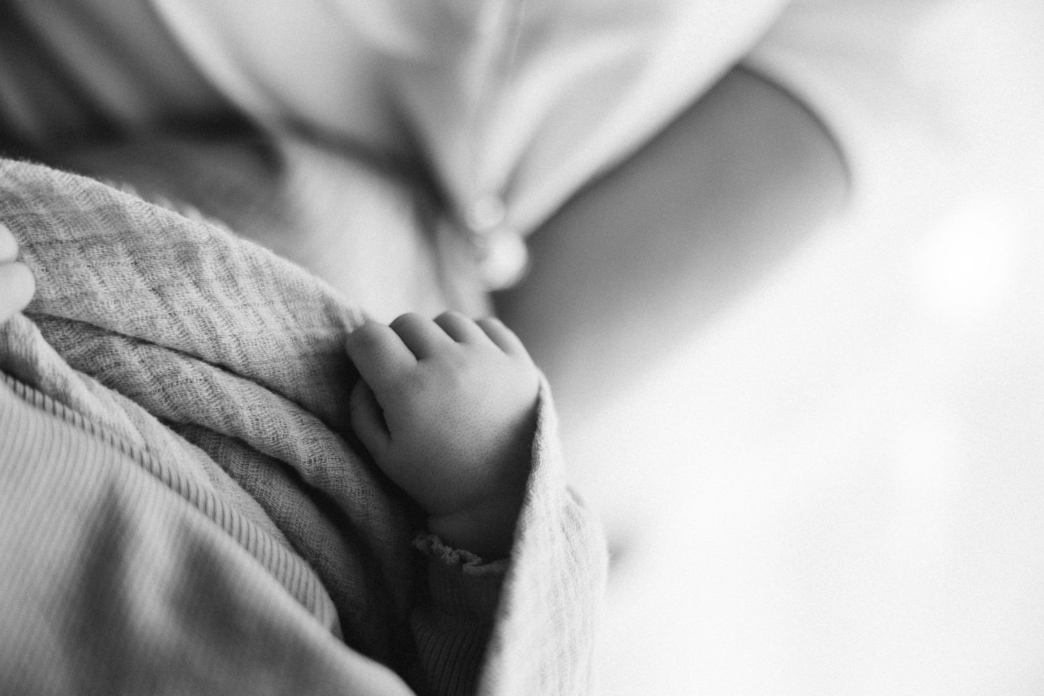 Tiny newborn hand in newborn photography studio canberra