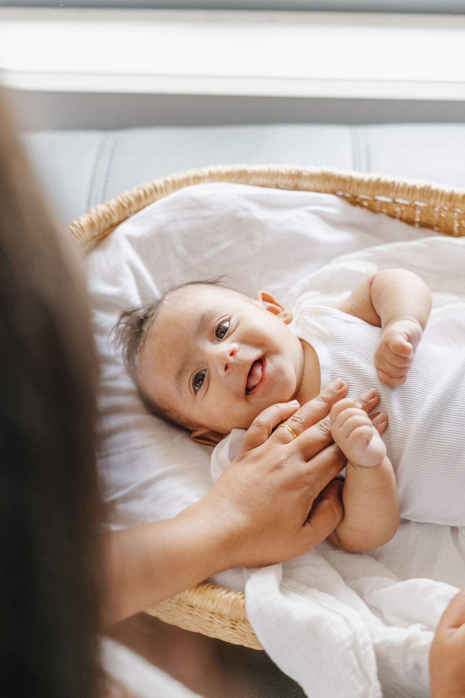 newborn baby boy smiles at his mother in Canberra