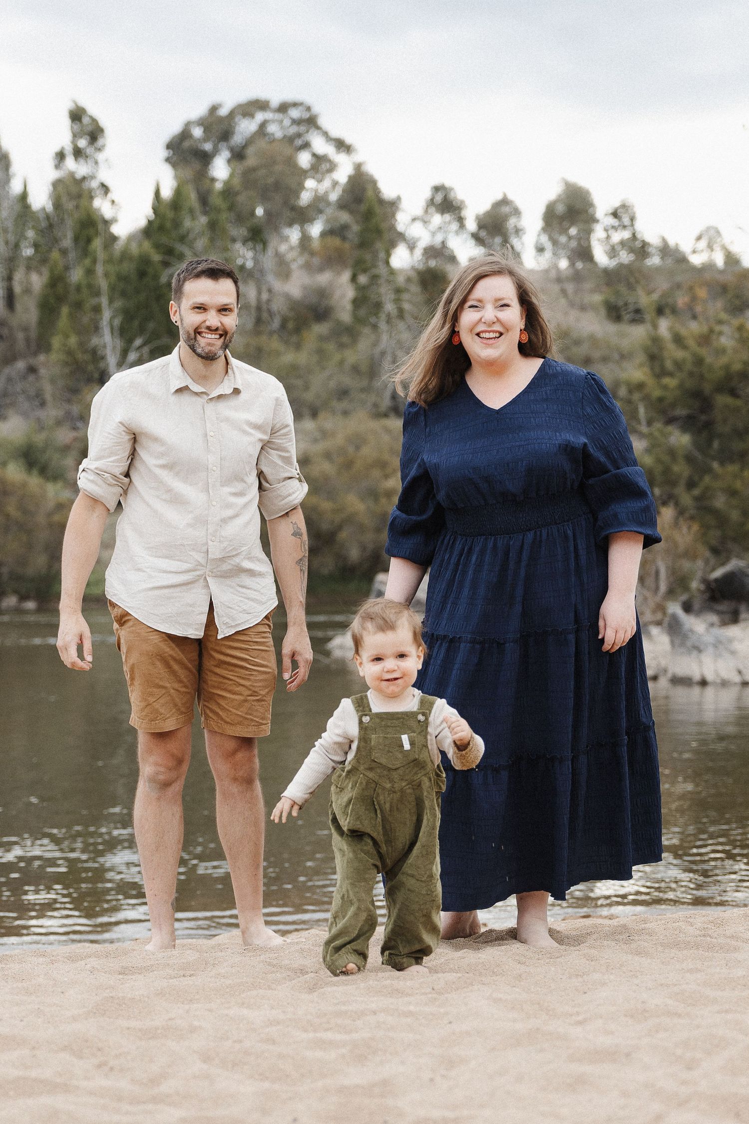 Toddler with his parents in an outdoors family photo session in Canberra