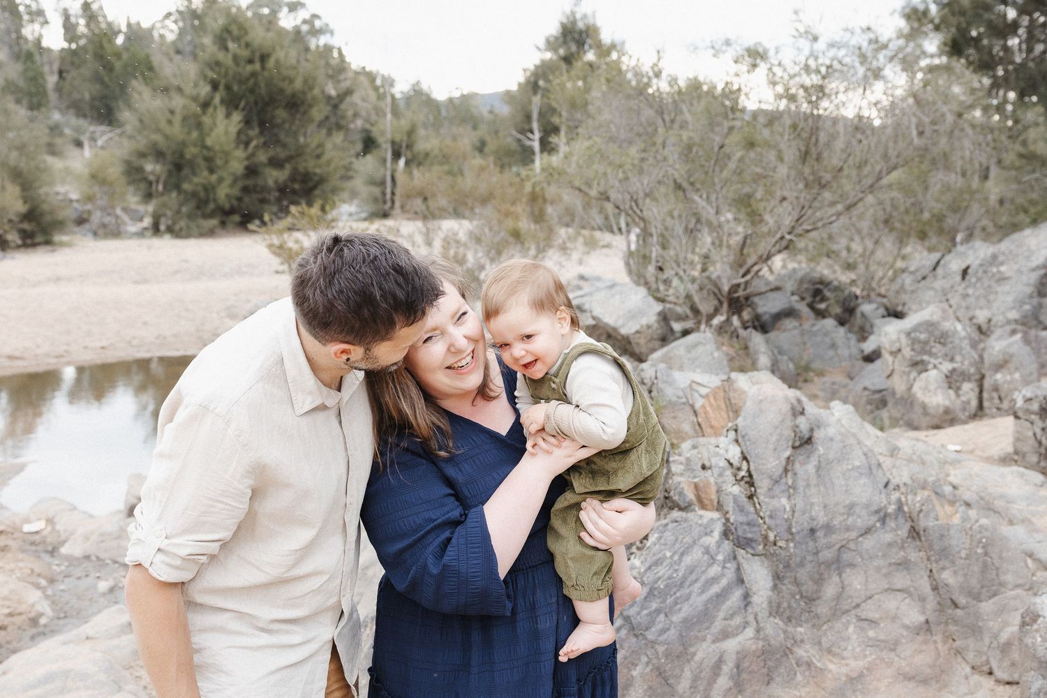 Tickling a toddler by the beach in a Canberra family photo session