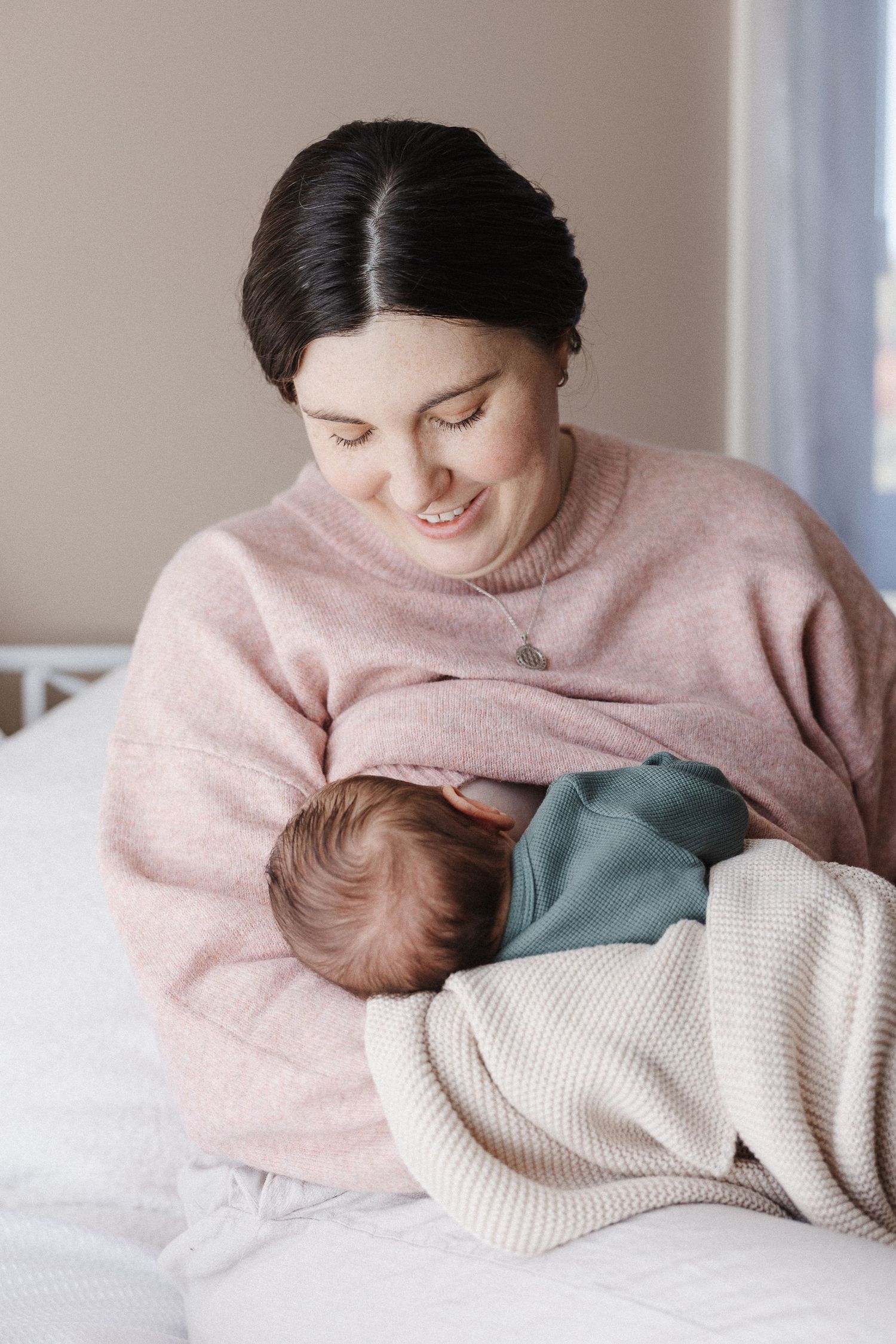 Photo of newborn baby breastfeeding in Belconnen Canberra photography studio
