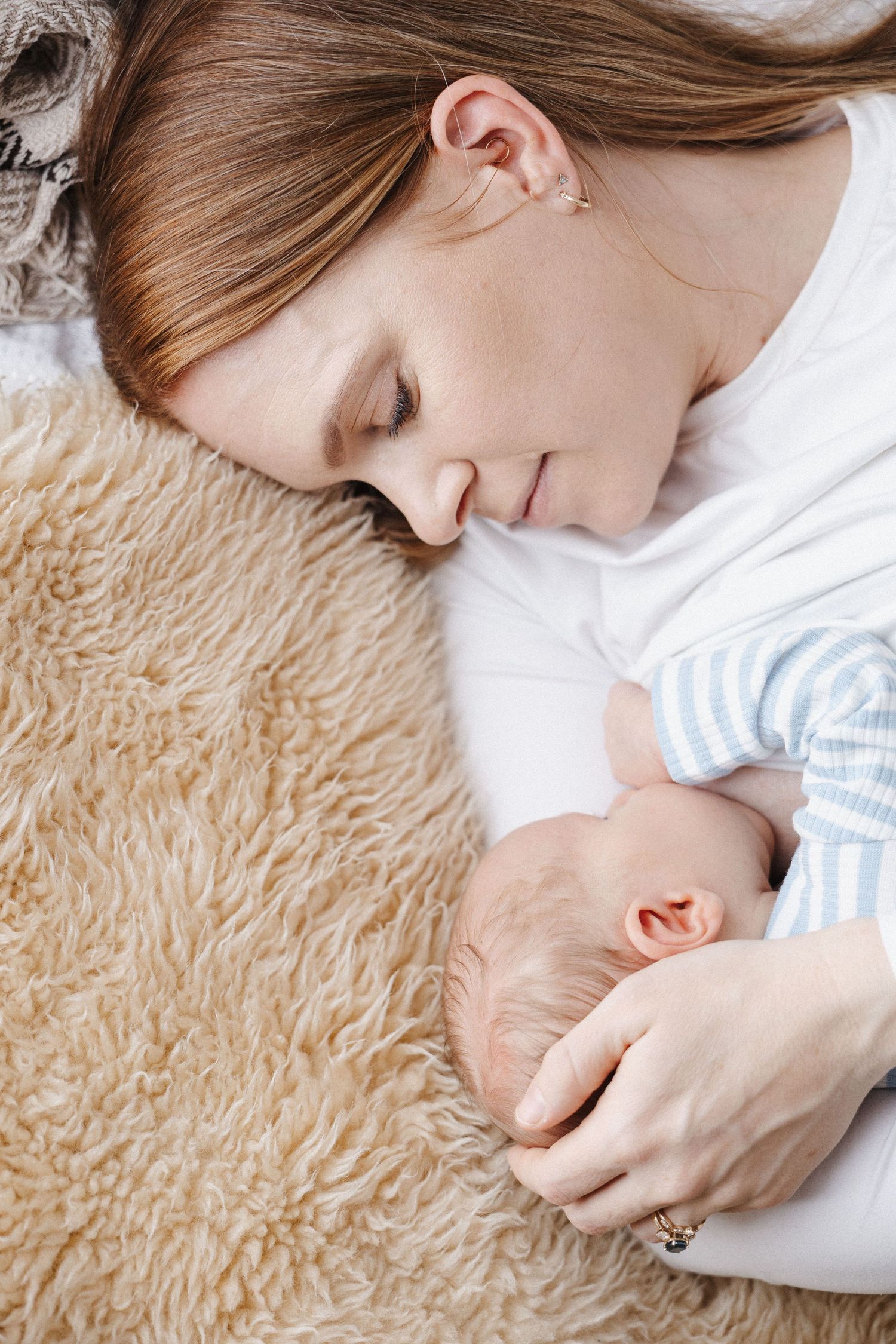 Mother breastfeeding her newborn in Bruce Canberra phot studio