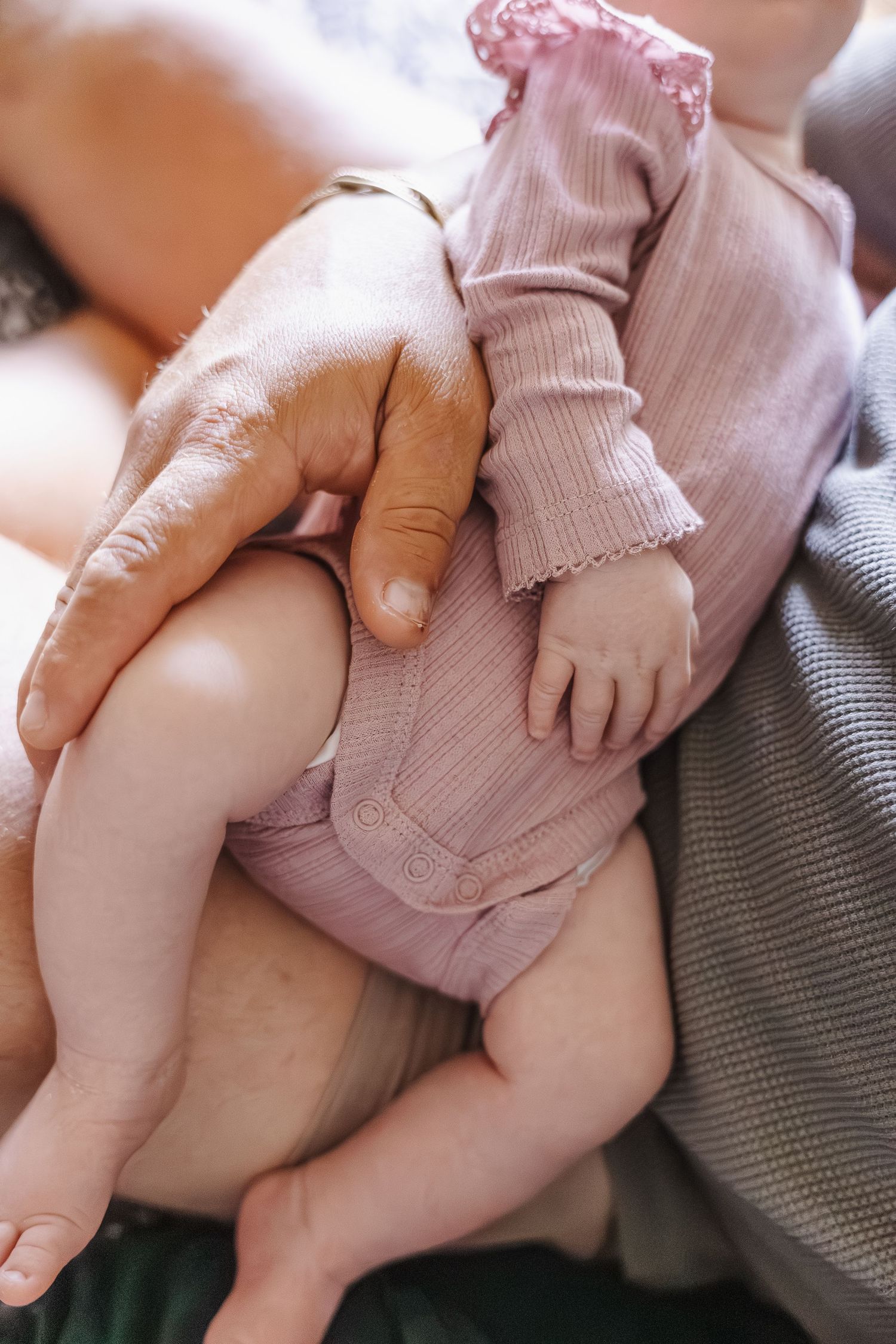 Dad holds his tiny baby in newborn photoshoot Canberra