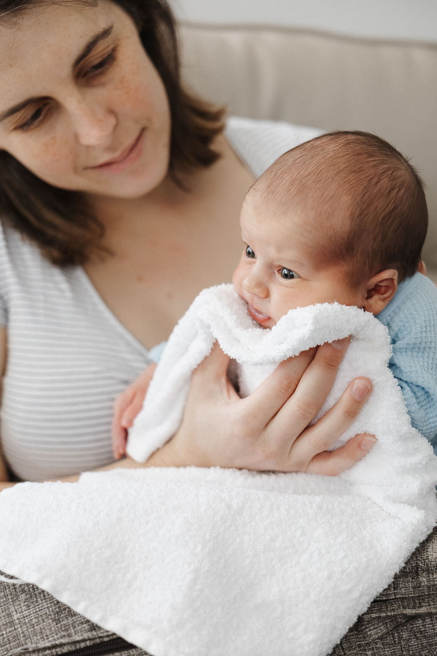A mother burps her newborn baby in Canberra