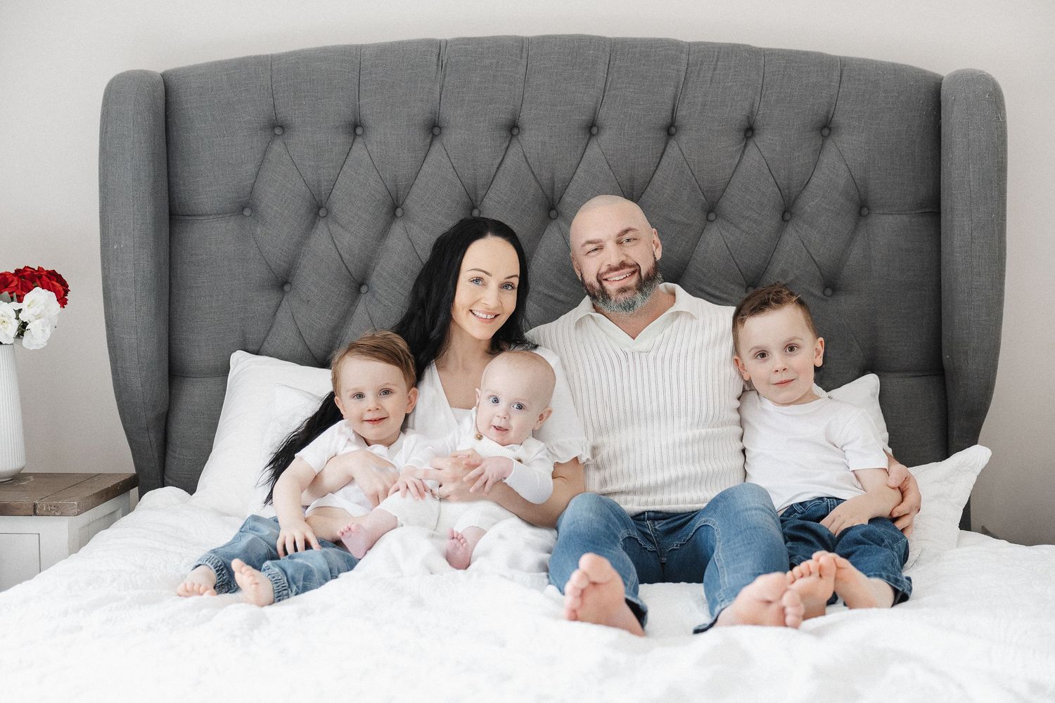 Happy family poses in formal portrait in Canberra family photoshoot