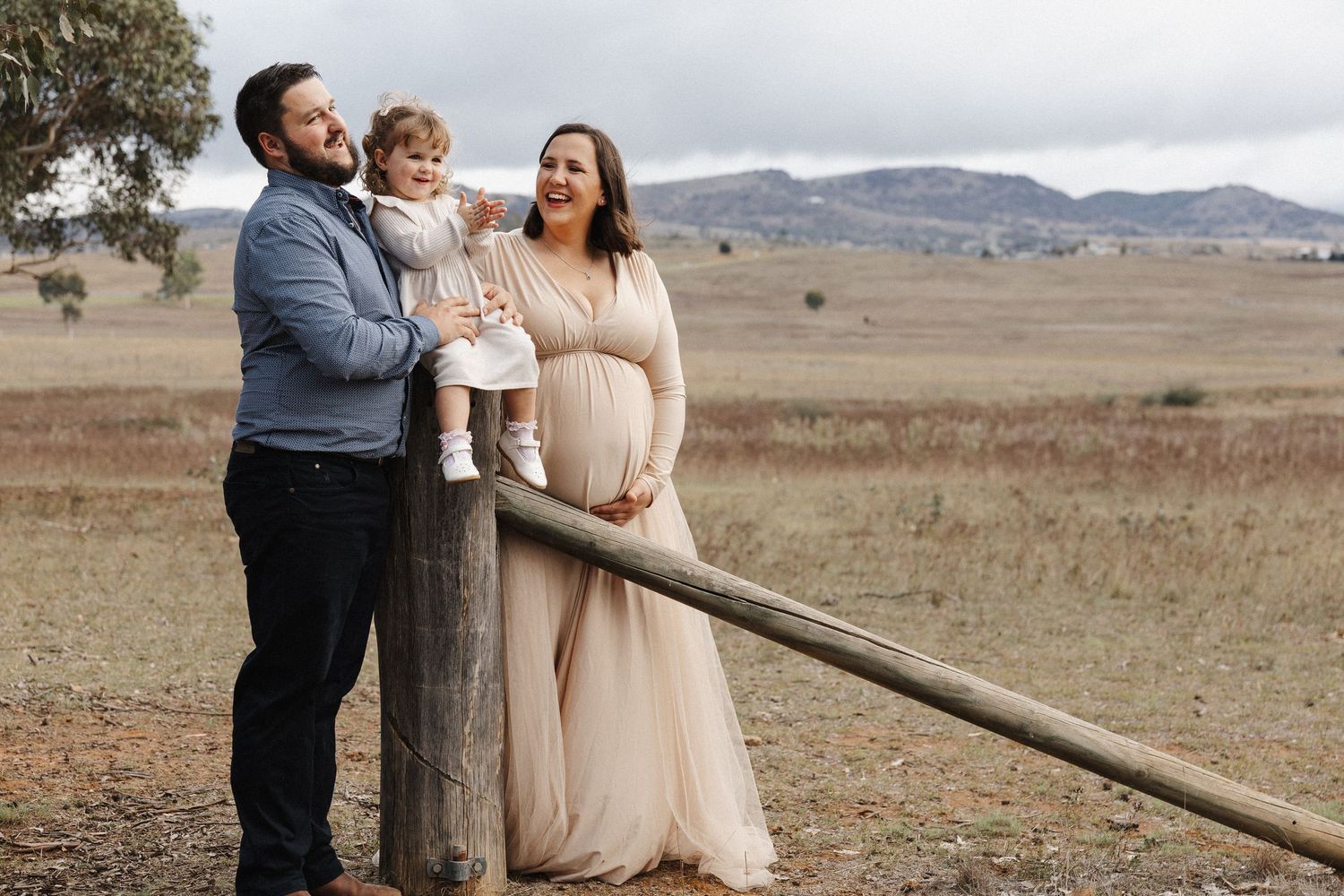pregnancy photo session in Canberra with family of three in a rustic rural setting
