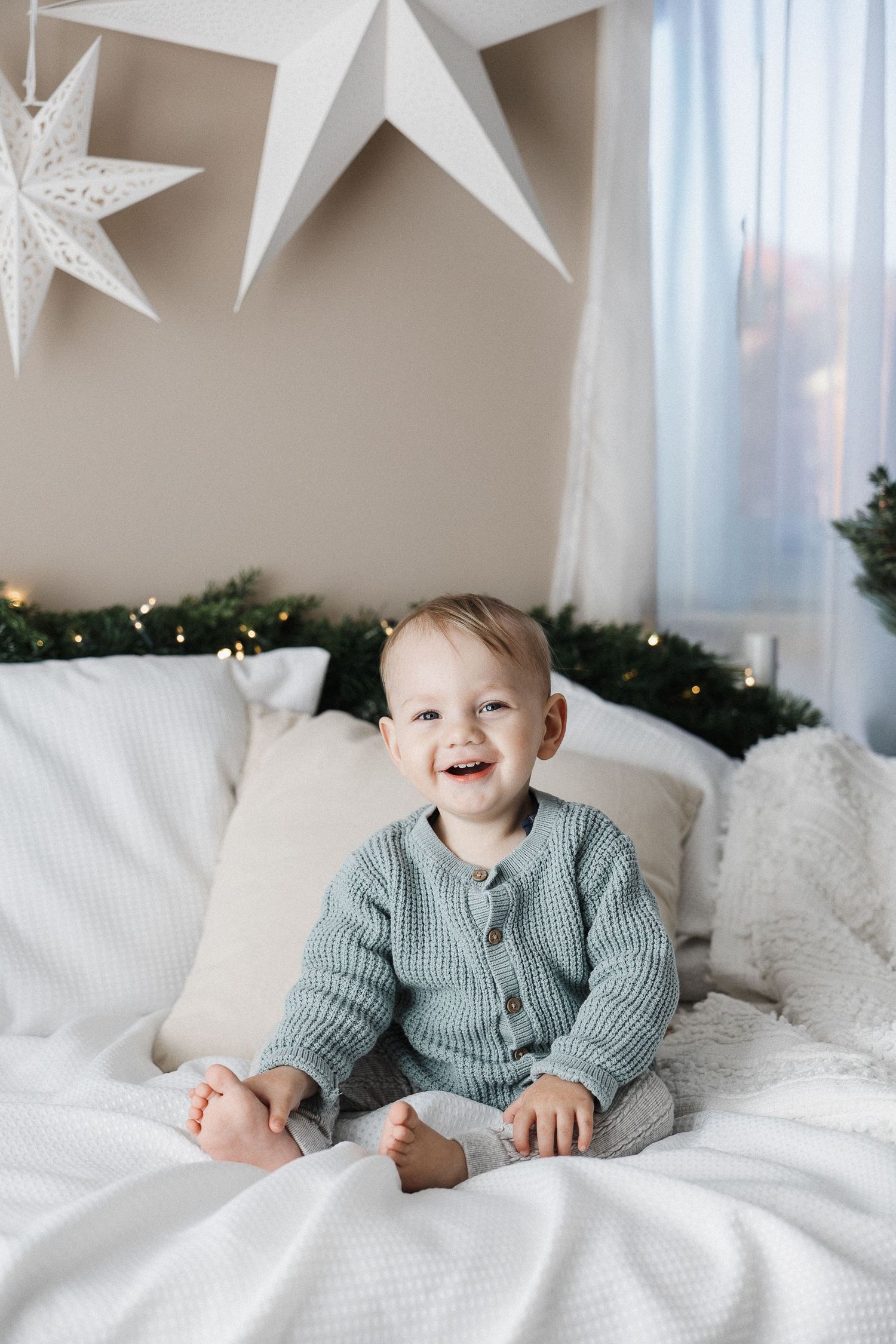 Baby laughing in Canberra Christmas mini photoshoot scene