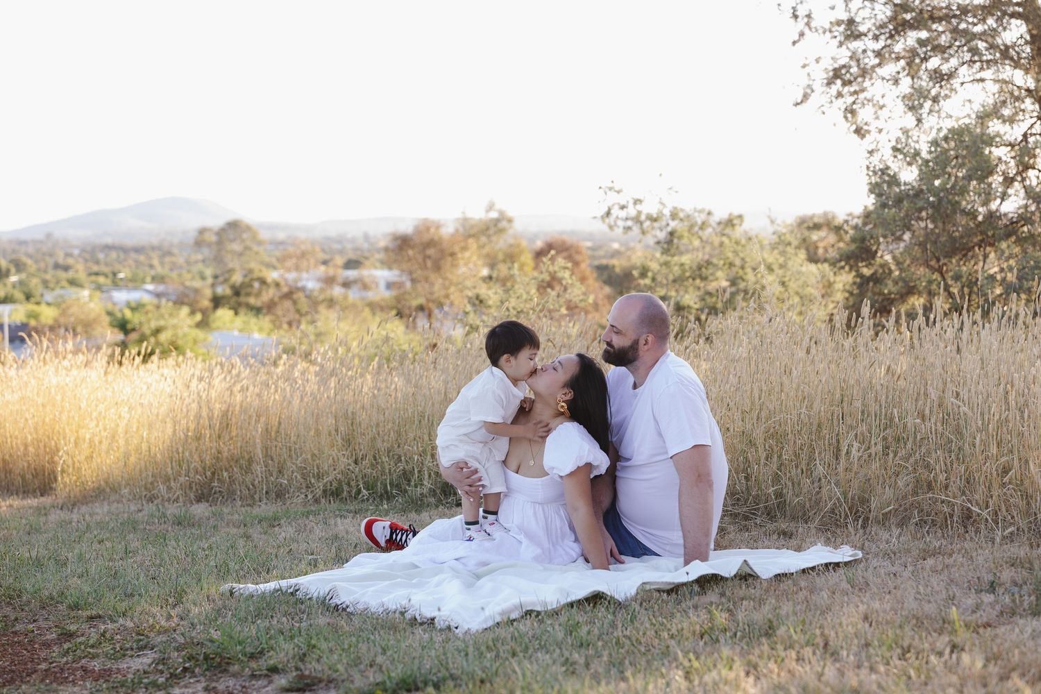 Kisses for mum in Canberra family photo shoot