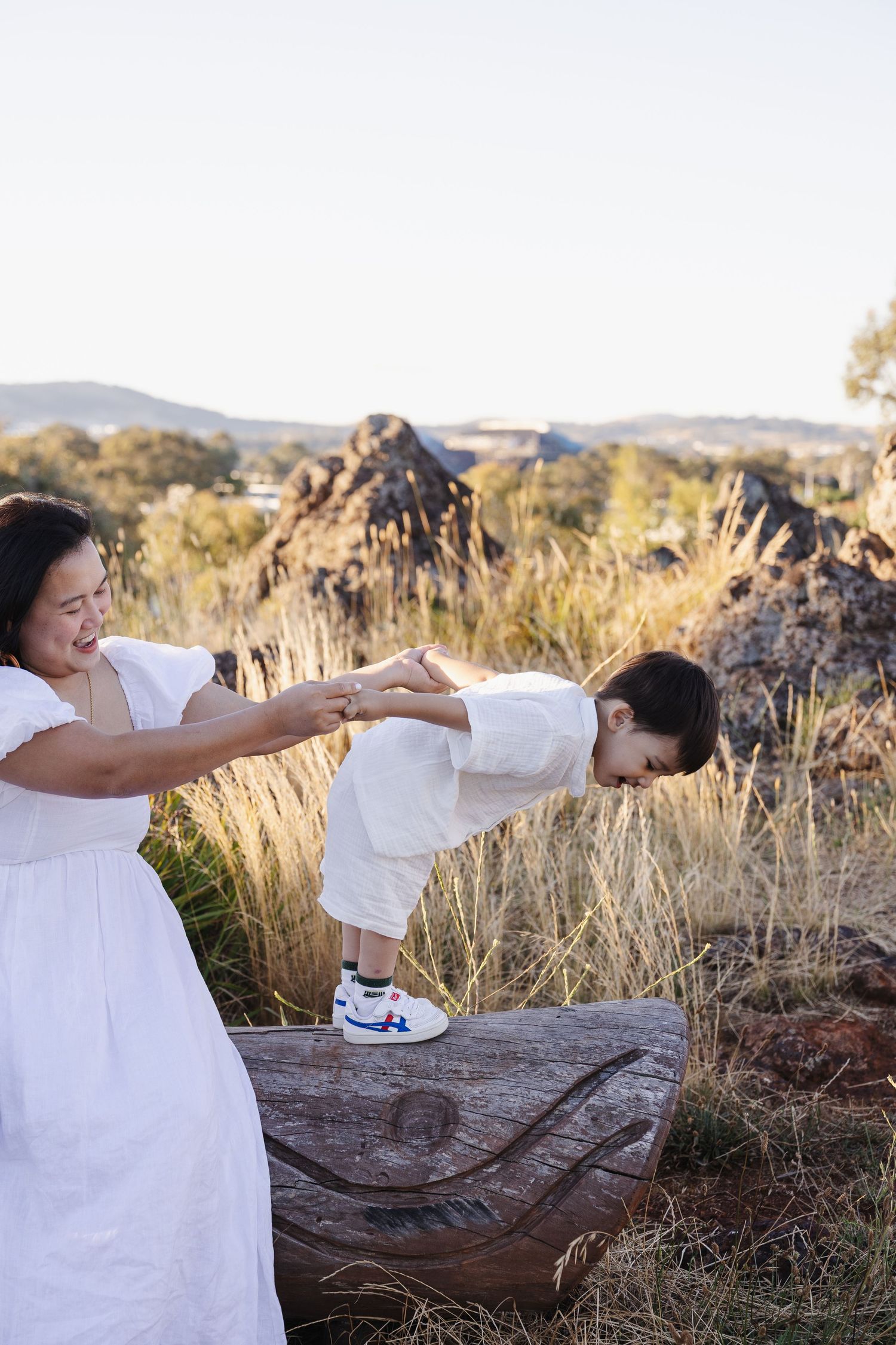 Toddler leans away from mum in Canberra family photo session