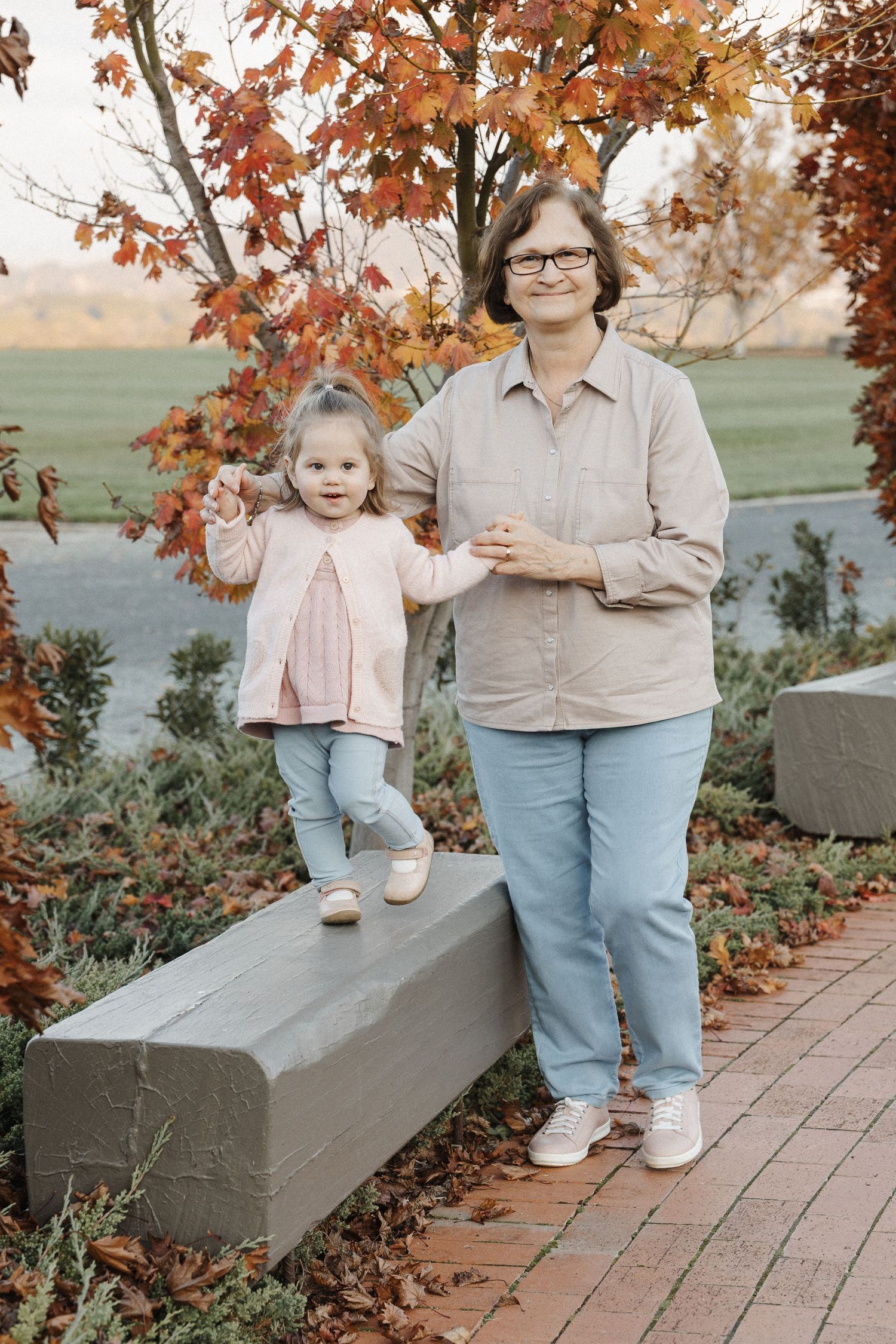 Grandmother and toddler with family photographer in Canberra Arboretum