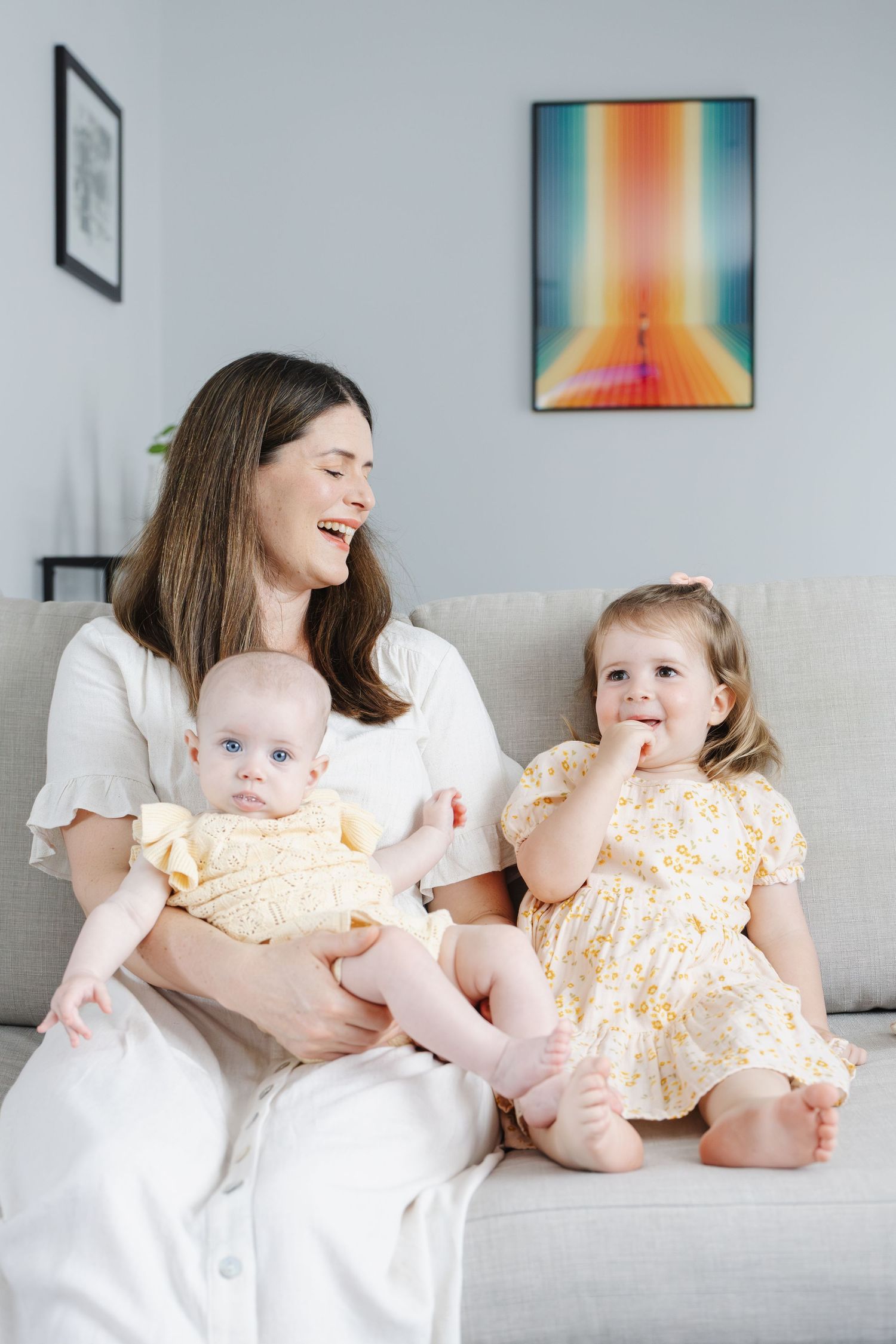 Laughing mum with daughters during their family photoshoot in Canberra