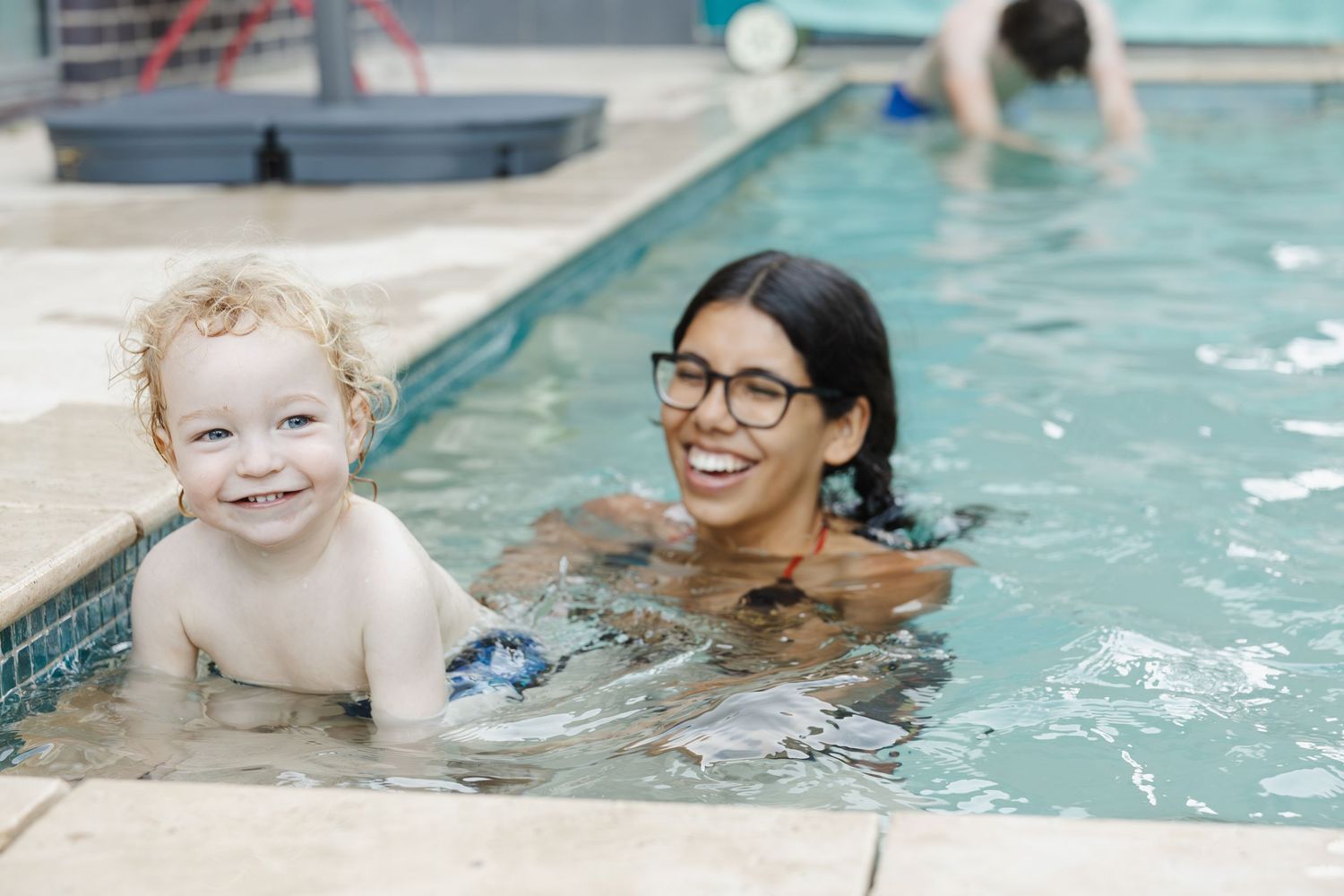 Toddler and girl in the pool in Canberra family photoshoot