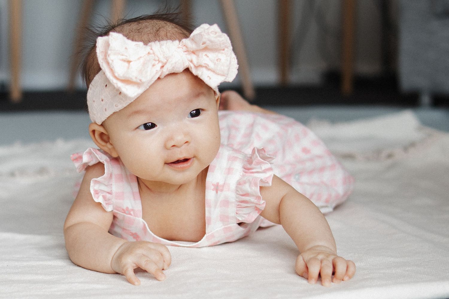 Tummy time for a baby girls 40 day milestone with a family photographer in Canberra