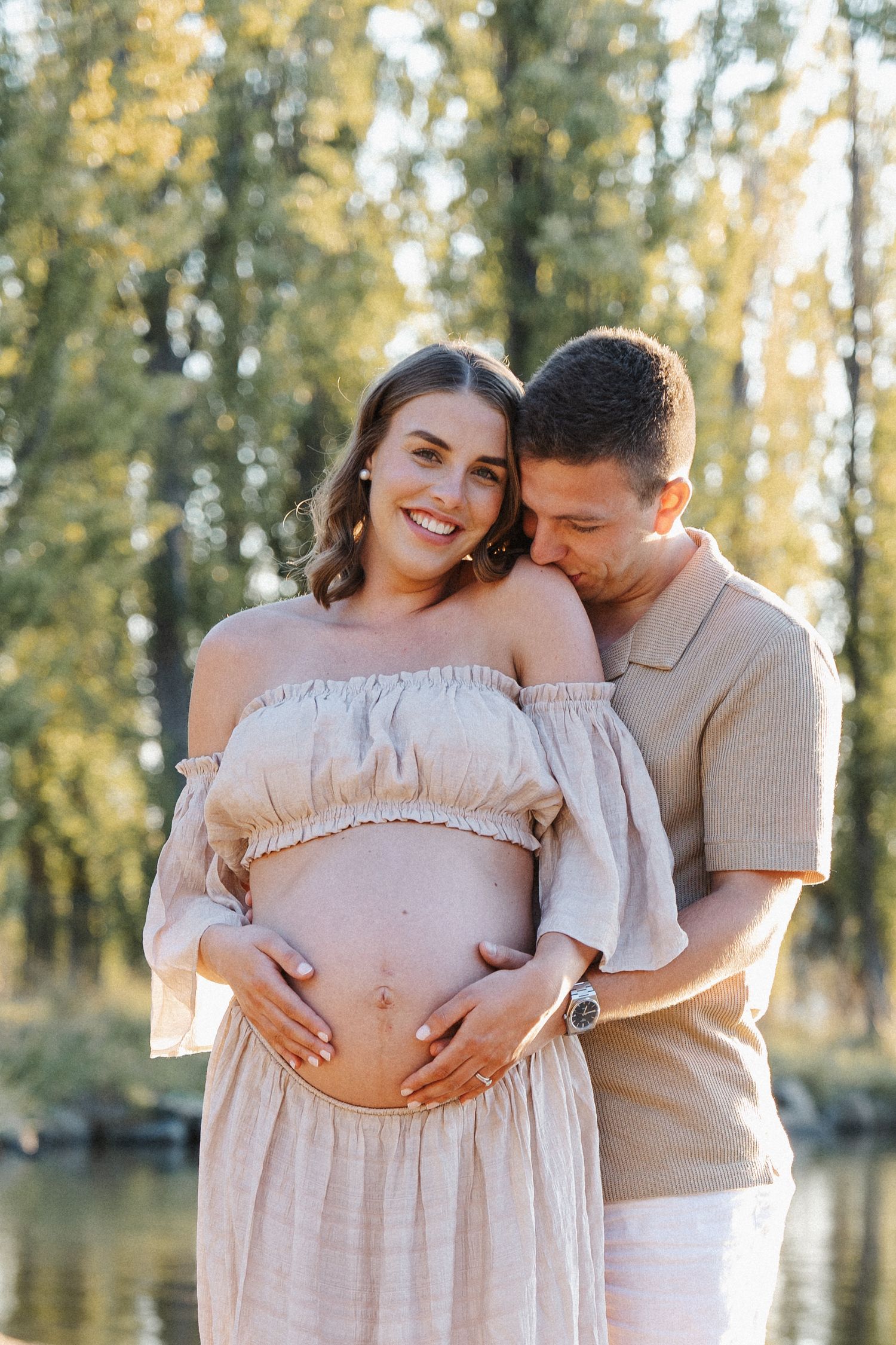 a happy expectant couple during a maternity photoshoot in Canberra
