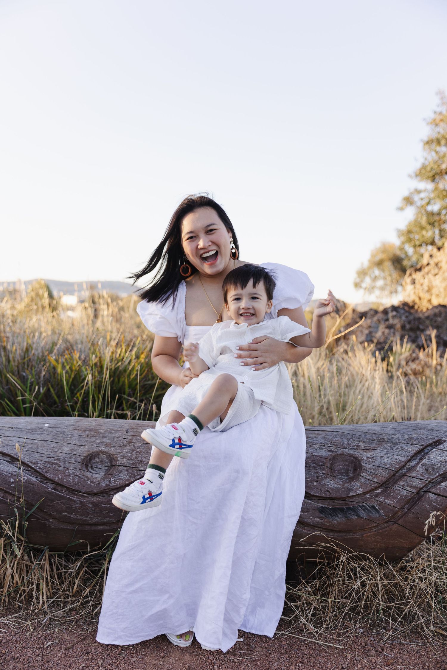 Mum cuddles toddler in Canberra family photoshoot