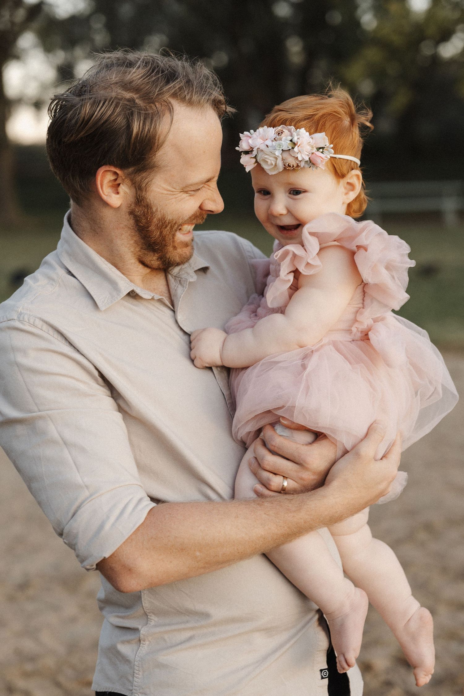 One year old laughing with her father in Canberra family photoshoot