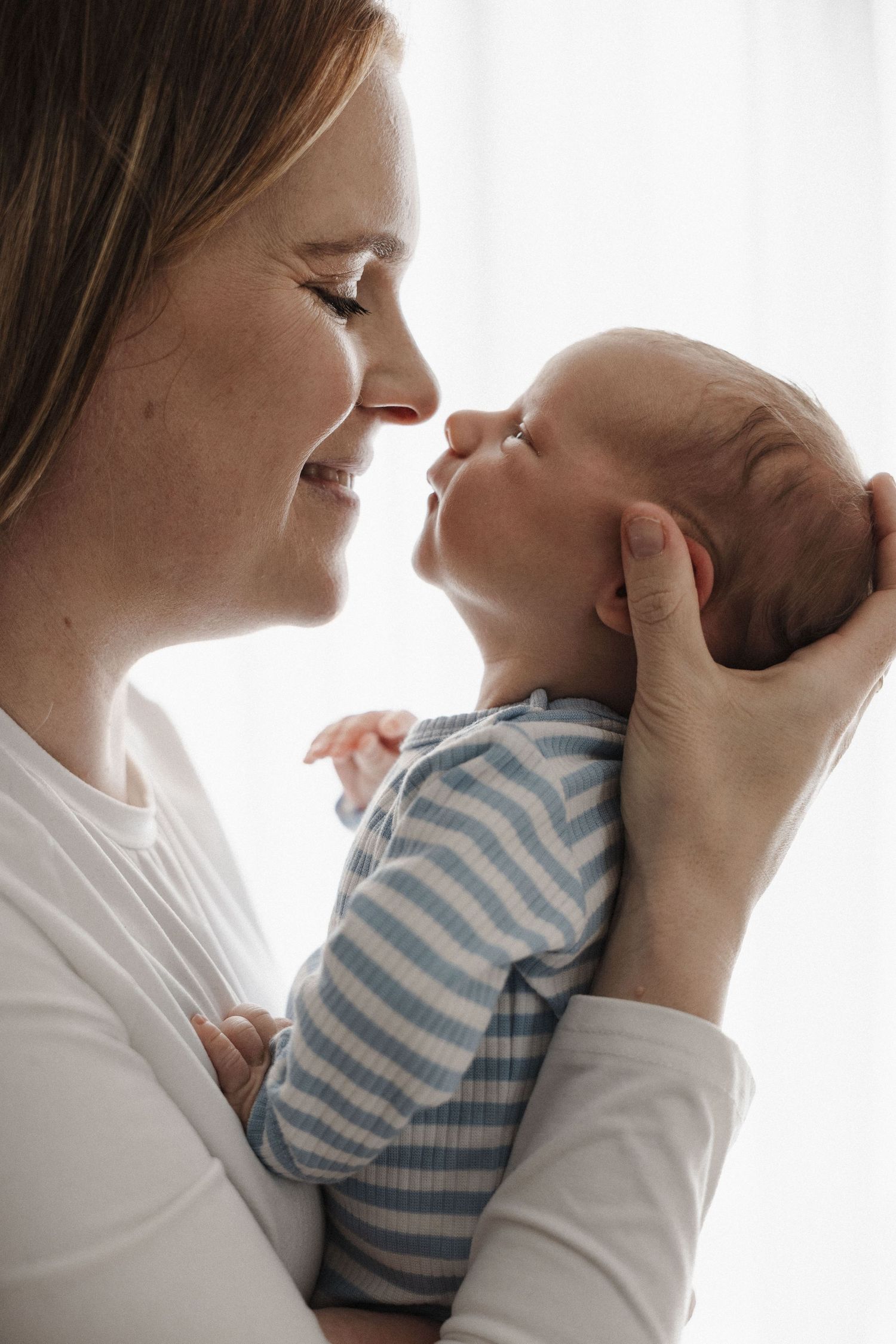 Mum nose to nose with her newborn in Canberra photo studio