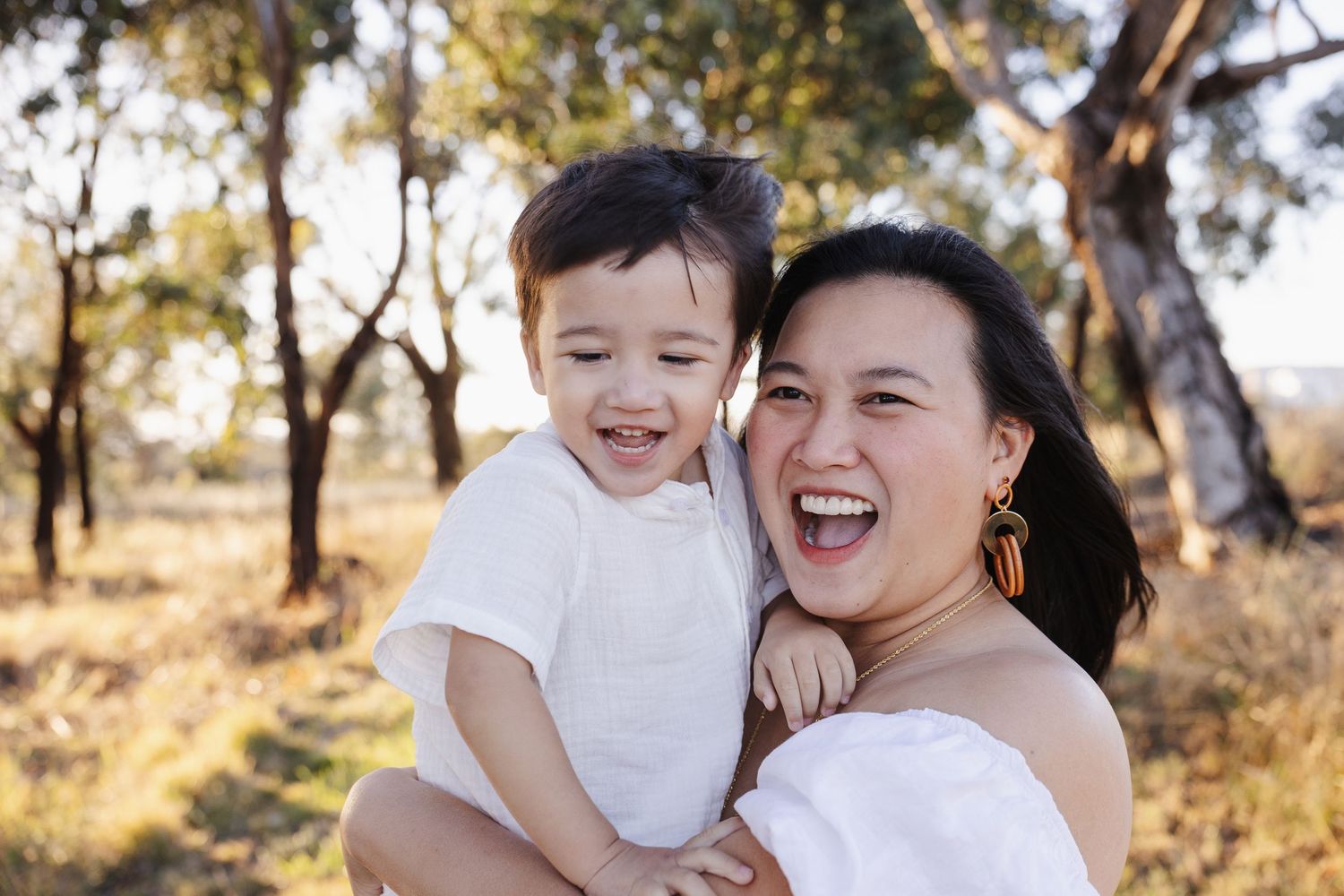 Mum and toddler laugh in Canberra family photoshoot